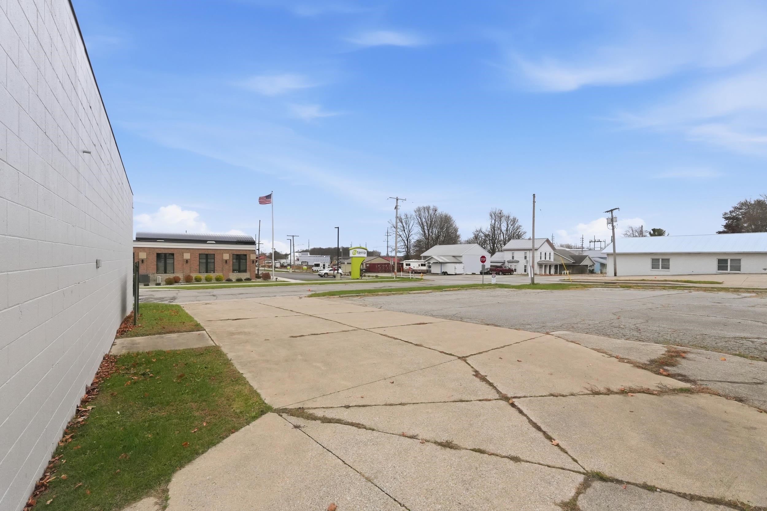 View of concrete driveway with a residential view