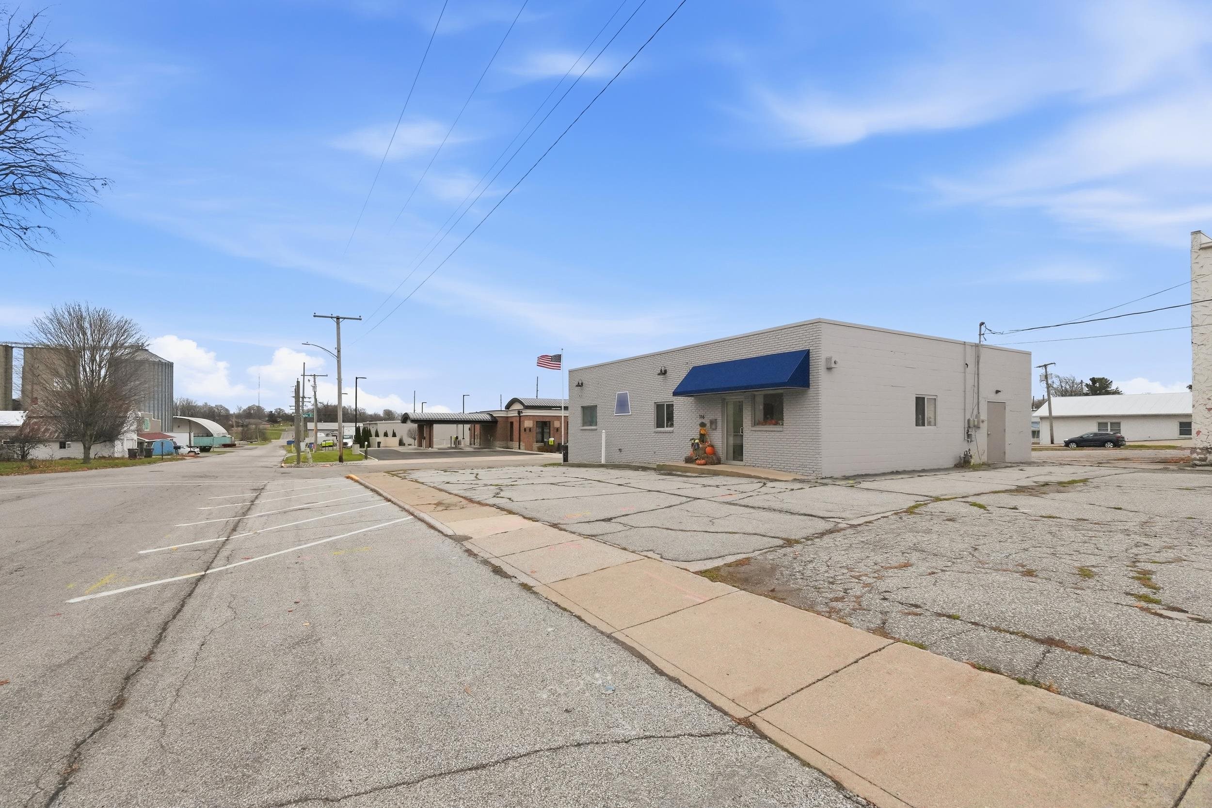 View of asphalt road with street lighting and sidewalks