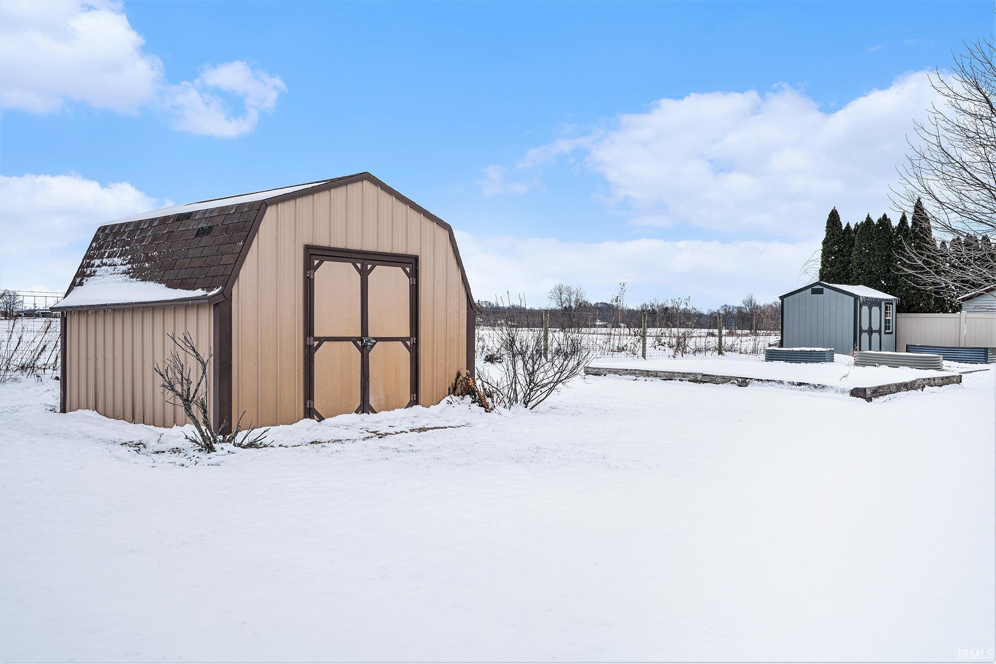 Snow covered structure with a storage unit