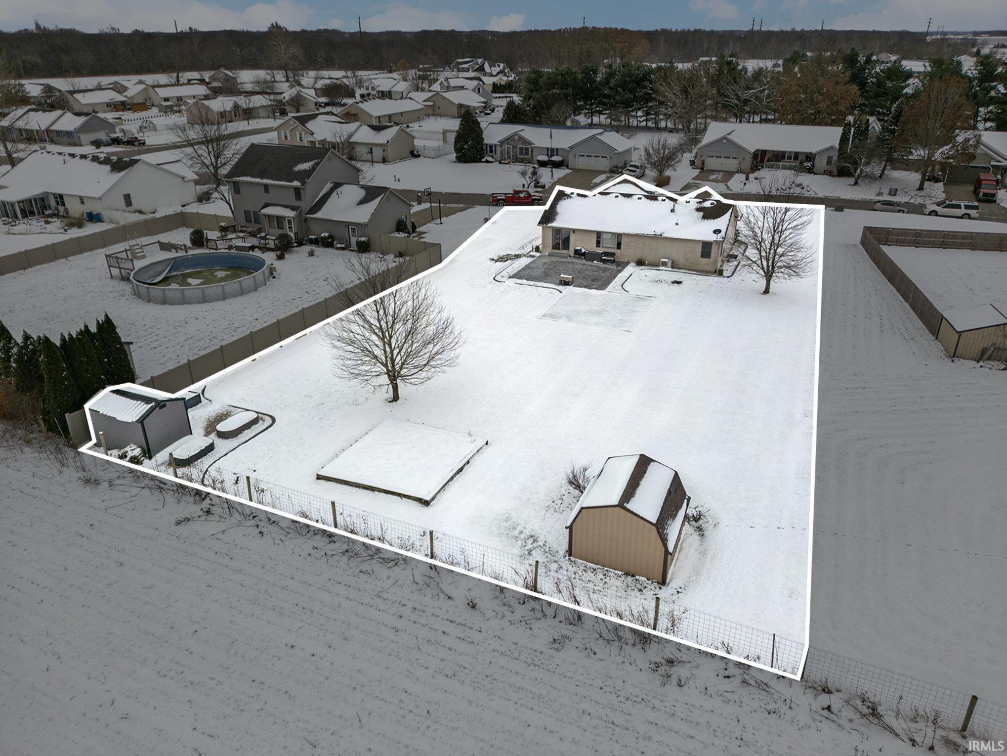 Snowy aerial view with a residential view