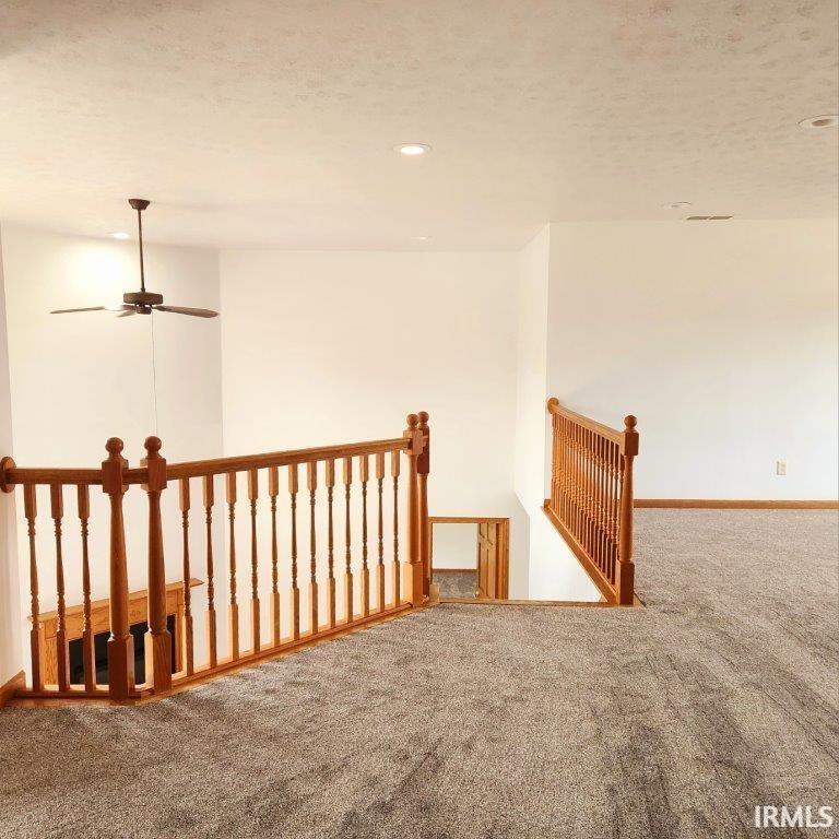 Carpeted empty room with recessed lighting and a ceiling fan