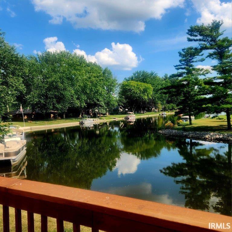 Water view with a tree filled landscape