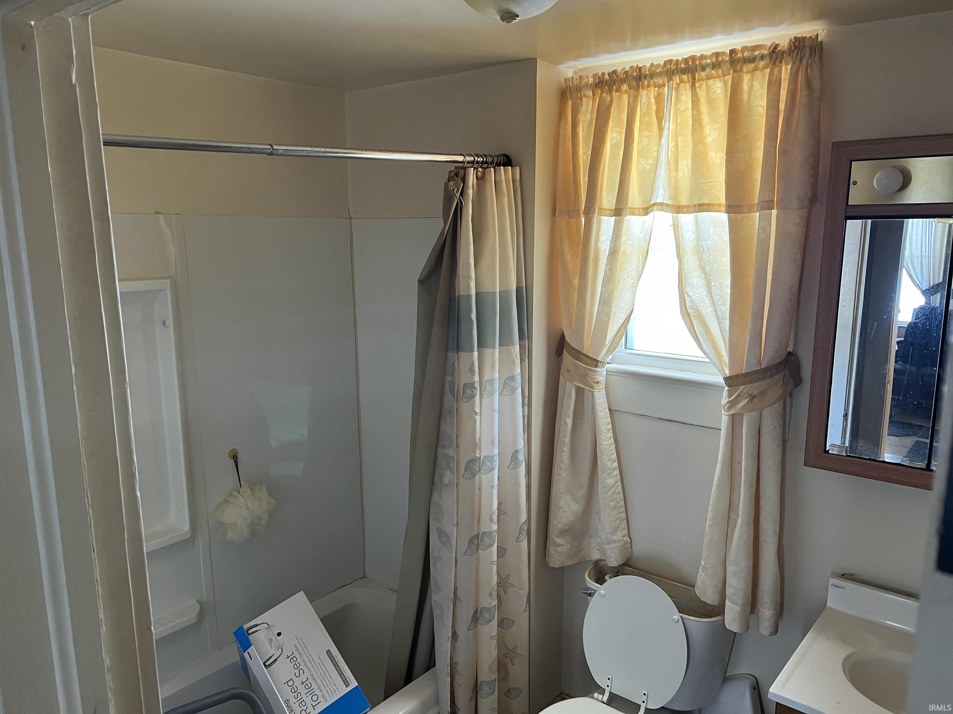 Full bathroom with vanity and shower / tub combo with curtain
