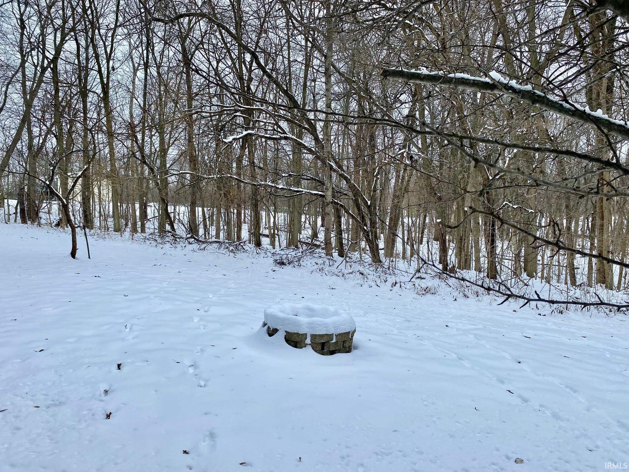 View of yard covered in snow