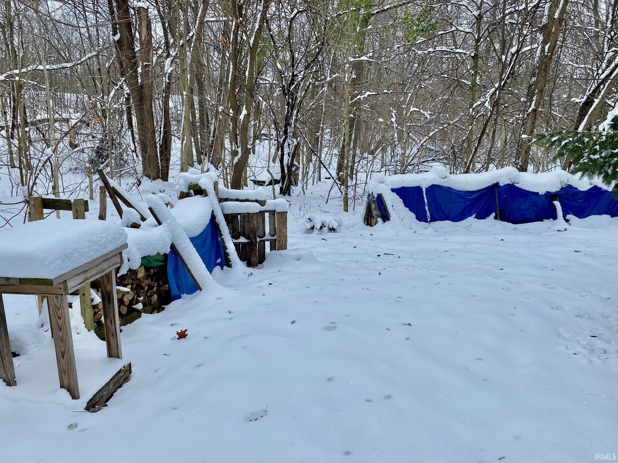 View of yard covered in snow