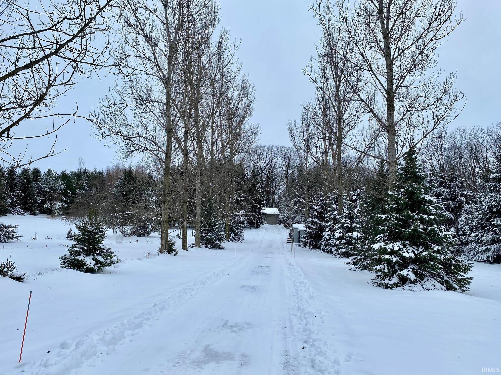 View of yard layered in snow