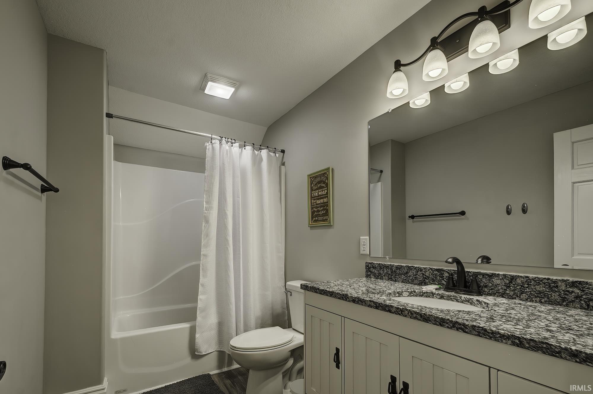 Full bathroom featuring vanity and shower / bath combo