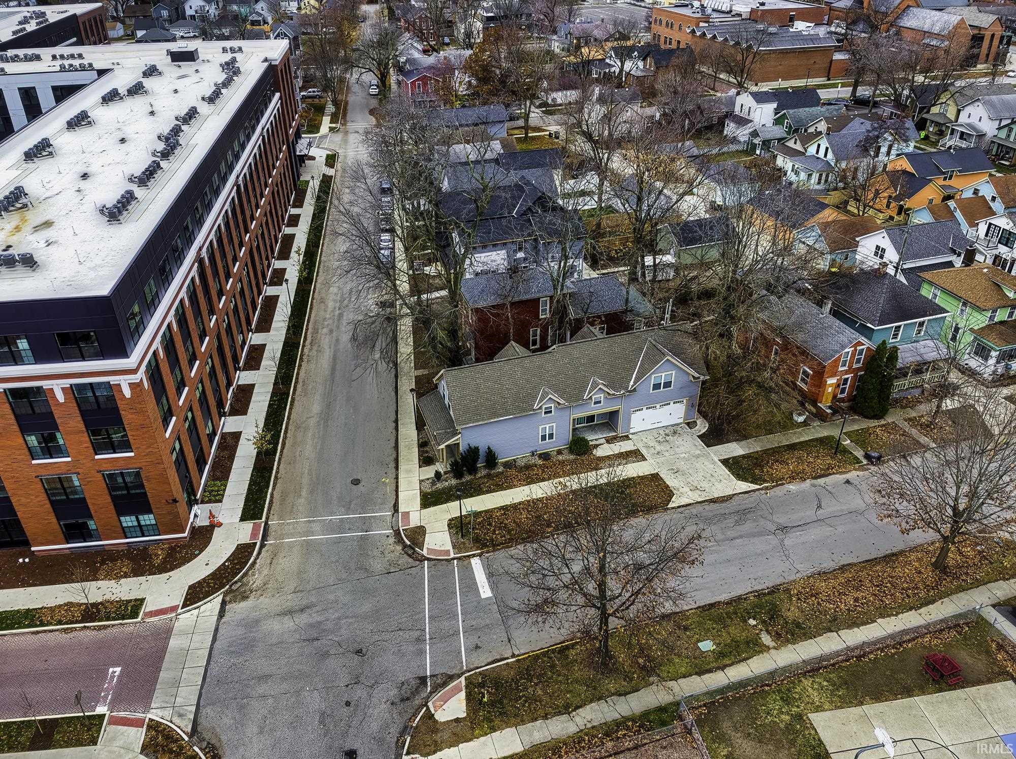 Aerial overview of property's location featuring nearby suburban area