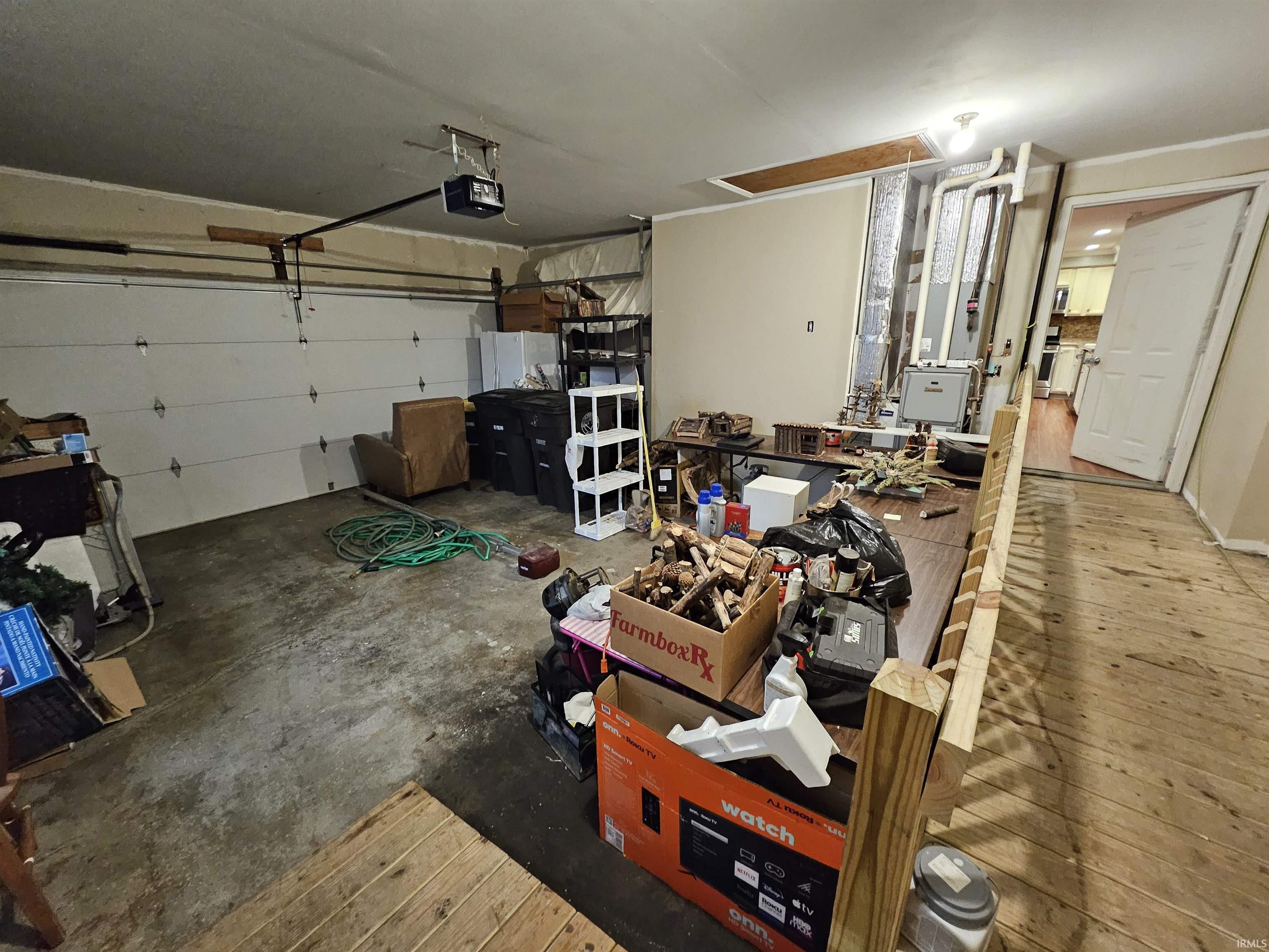 Garage featuring a garage door opener