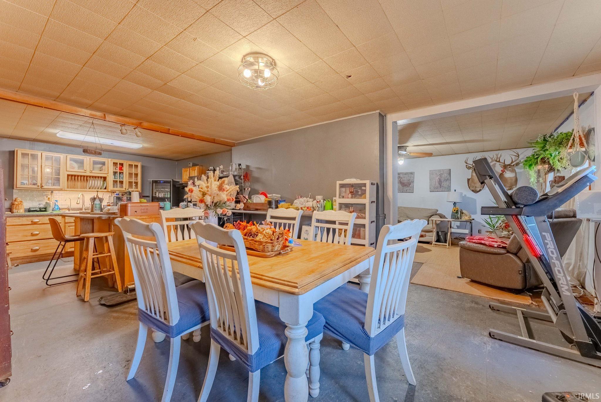 Dining room featuring concrete flooring
