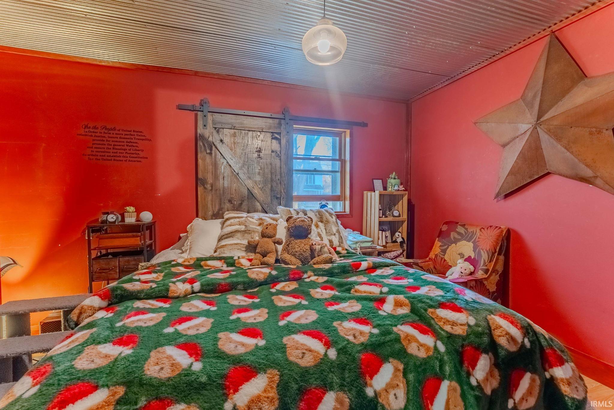 Bedroom featuring a barn door