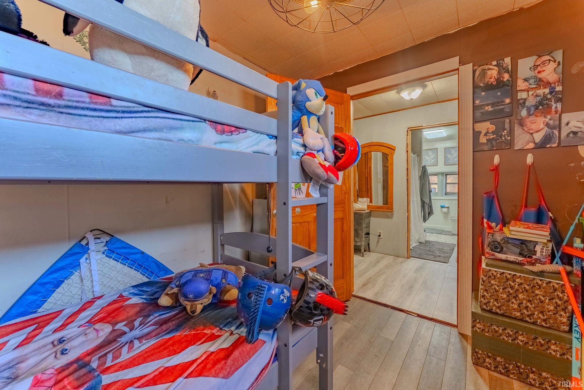Bedroom with wood finished floors