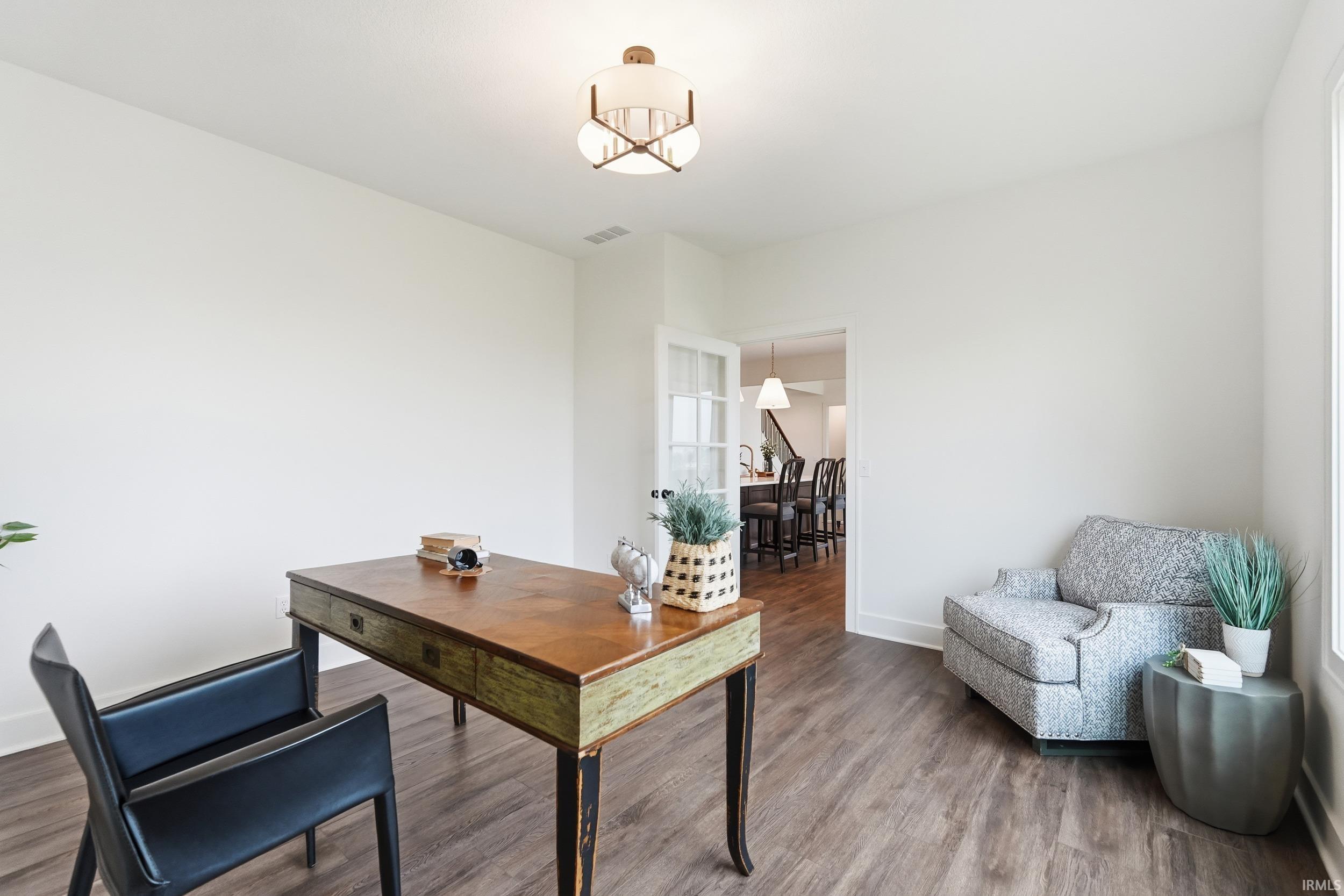 Home office featuring wood finished floors