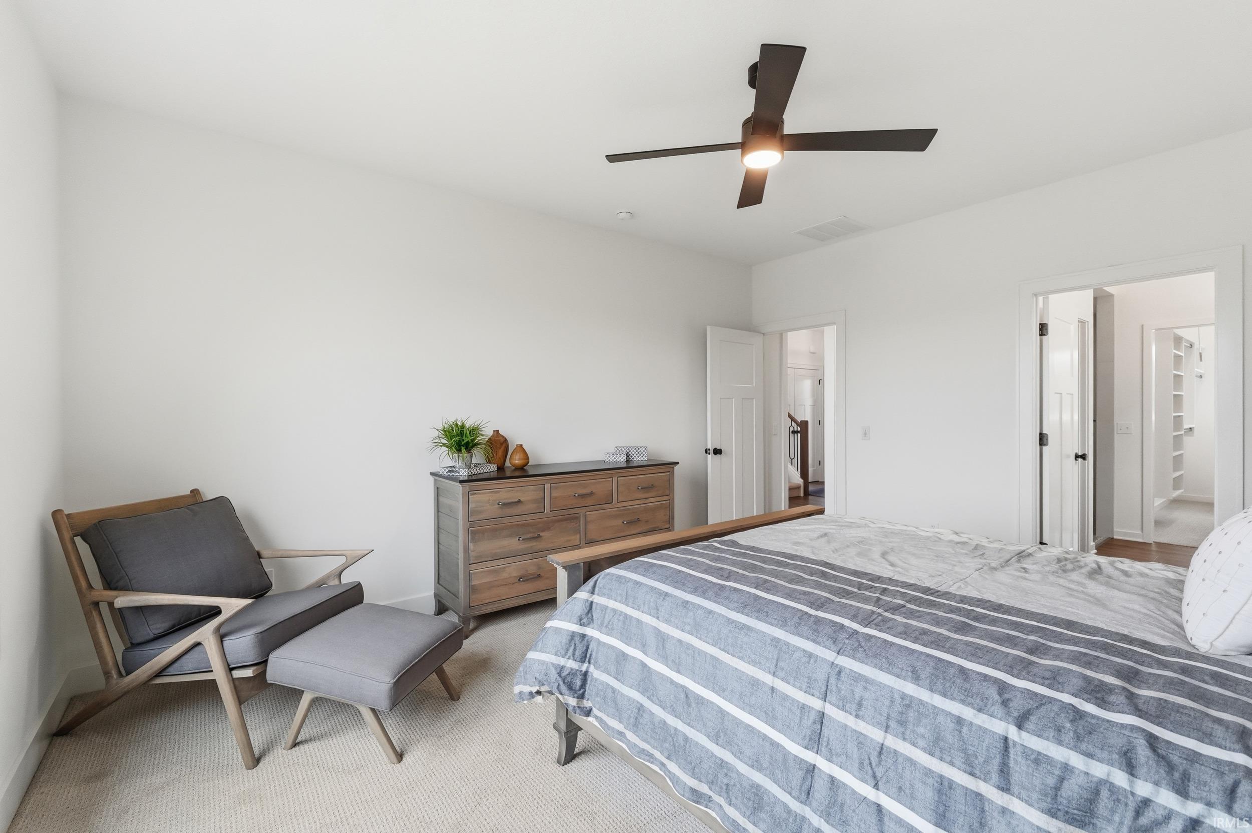Bedroom with carpet floors and ceiling fan