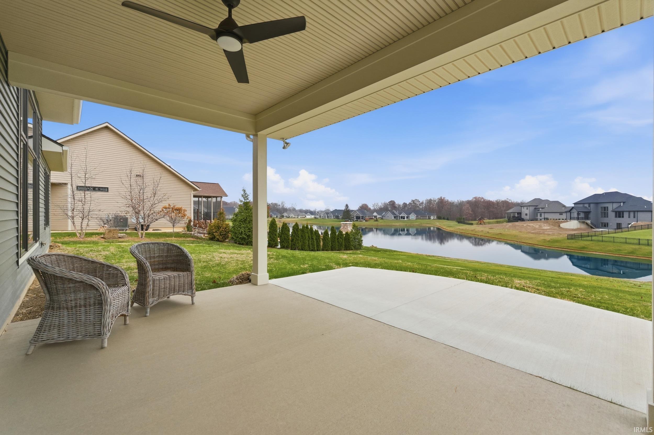 View of patio / terrace featuring a water view and a ceiling fan