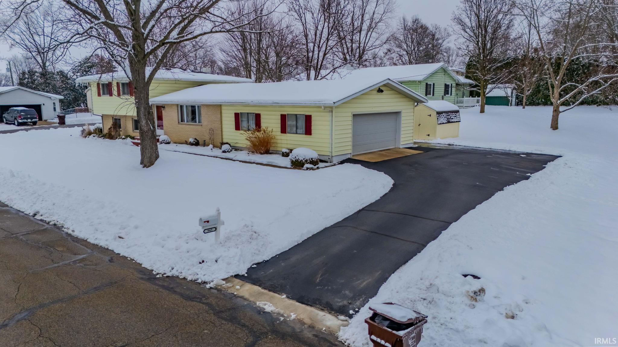 View of front of property with brick siding