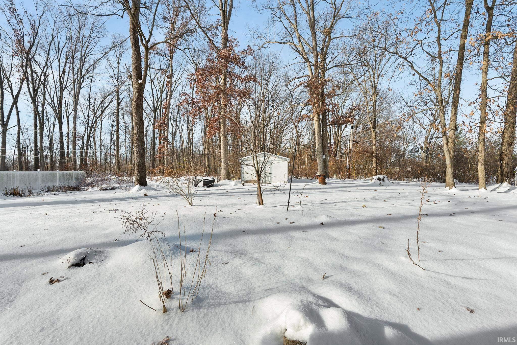 View of yard layered in snow
