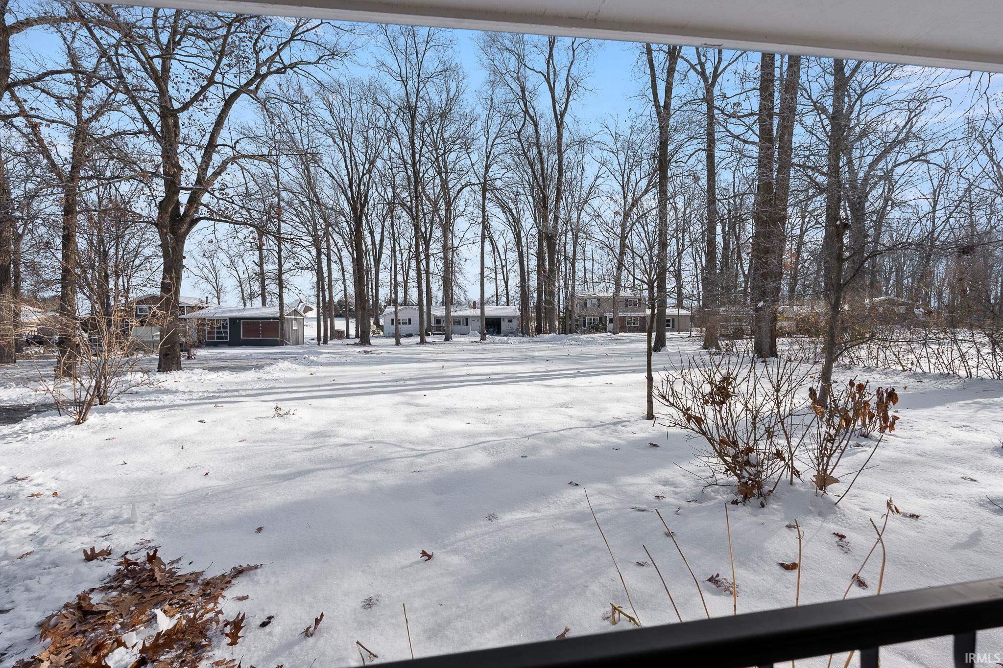 View of yard layered in snow