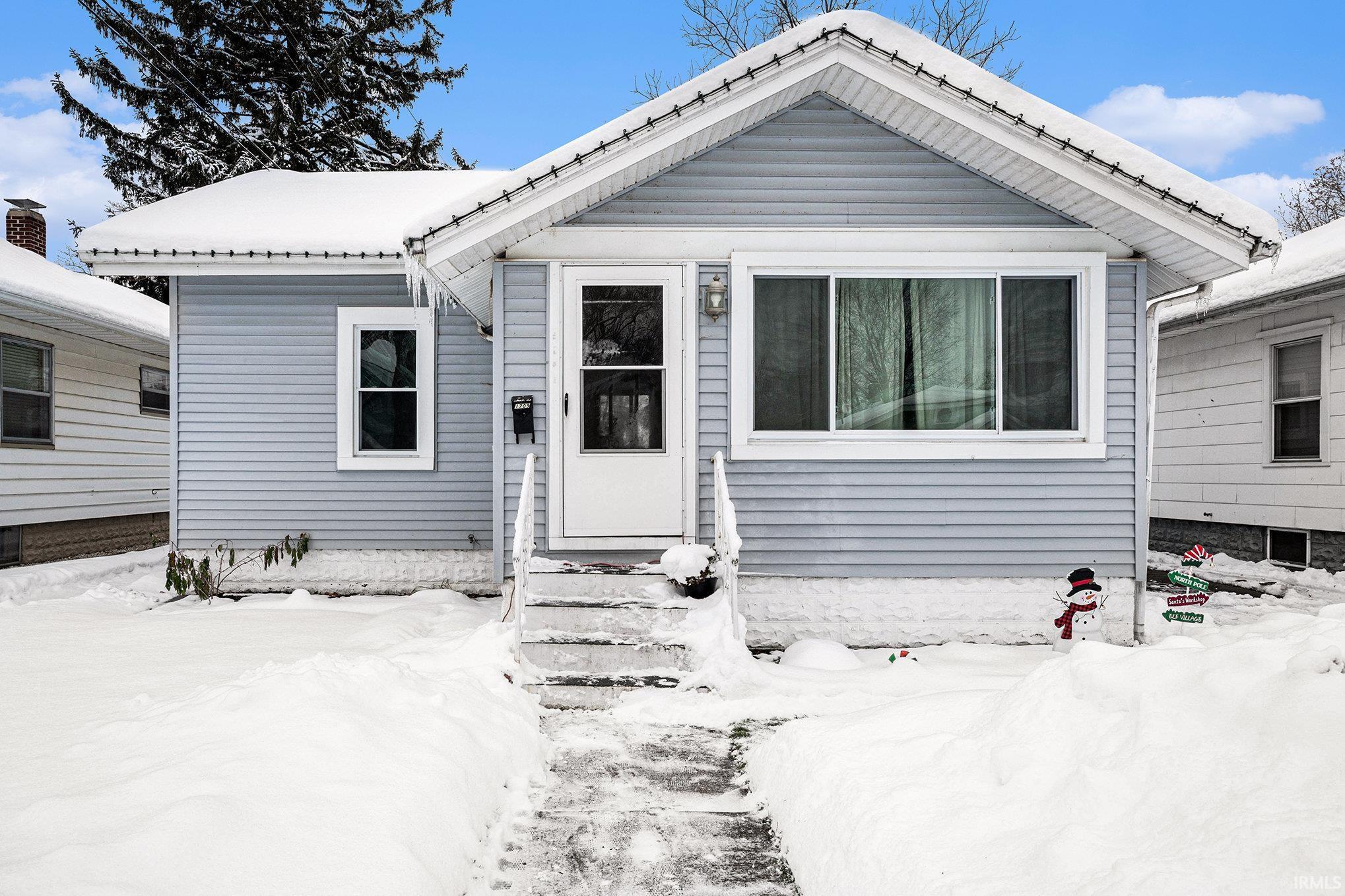 View of front of home featuring entry steps
