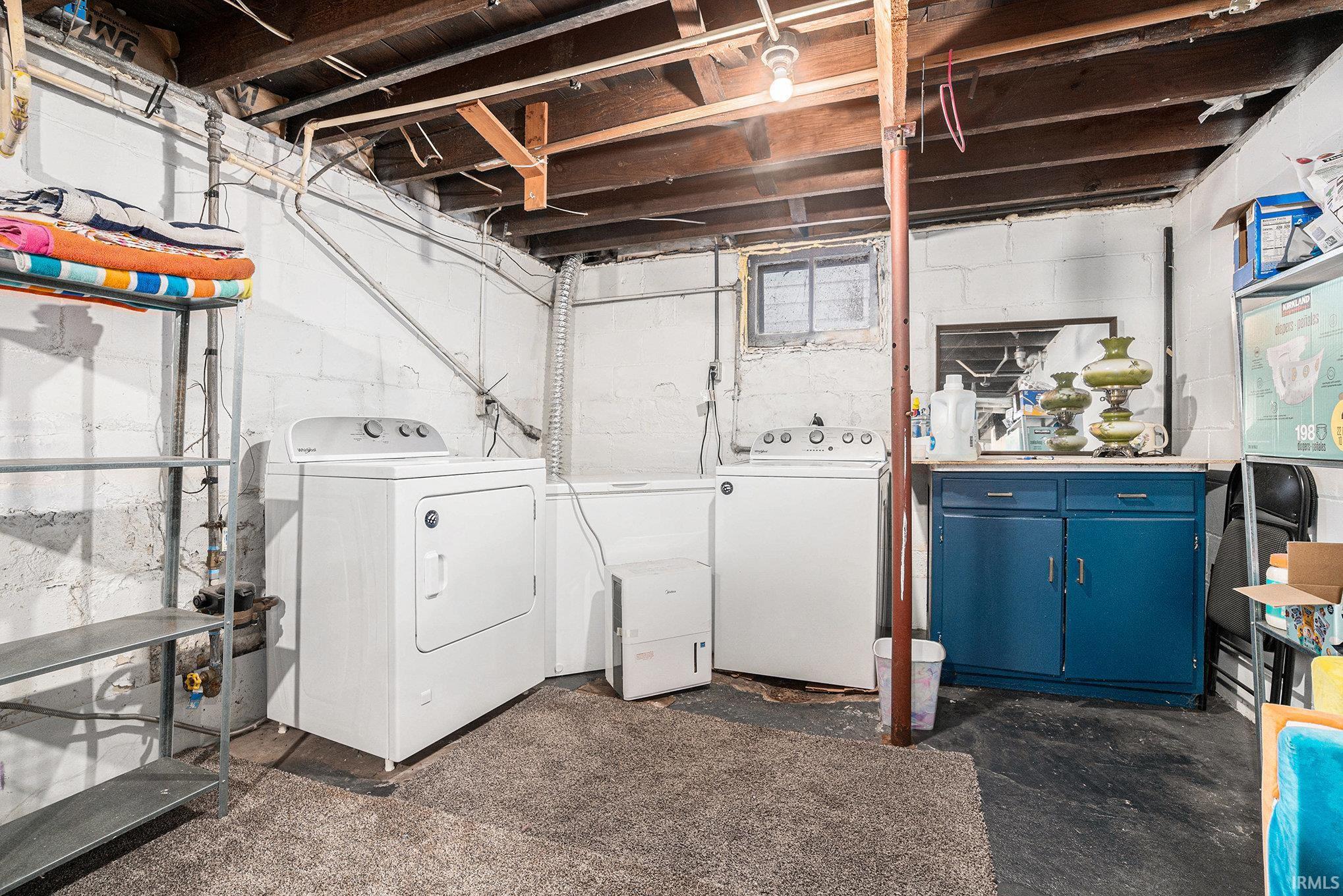 Laundry room featuring separate washer and dryer