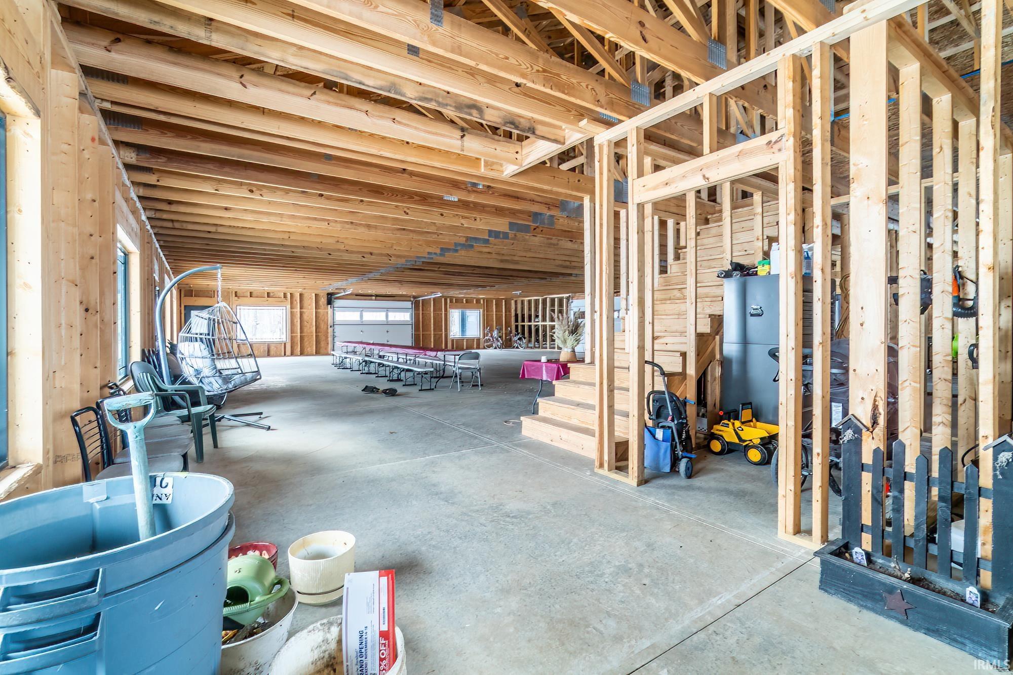 Miscellaneous room featuring unfinished concrete floors