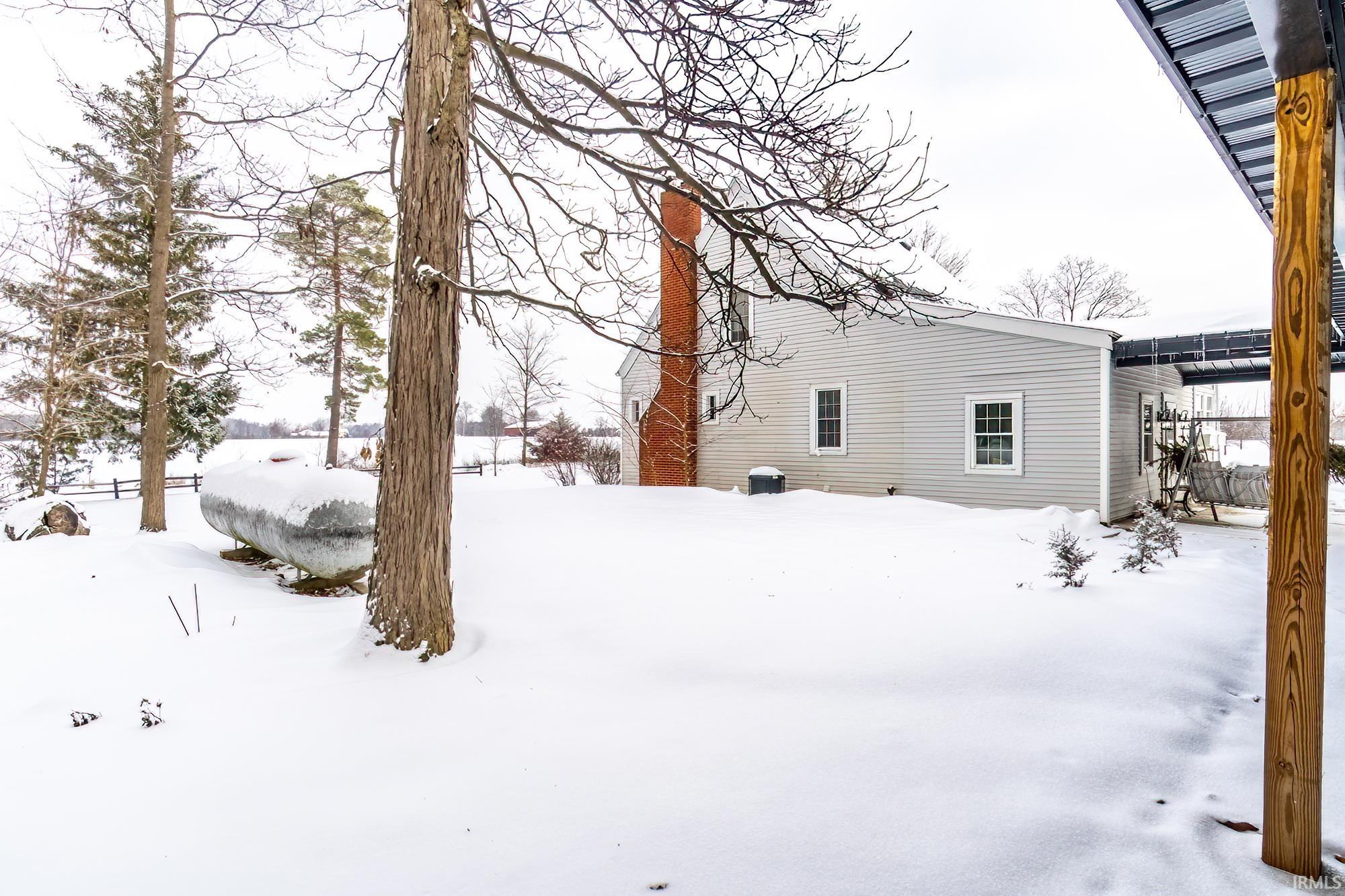 View of yard layered in snow