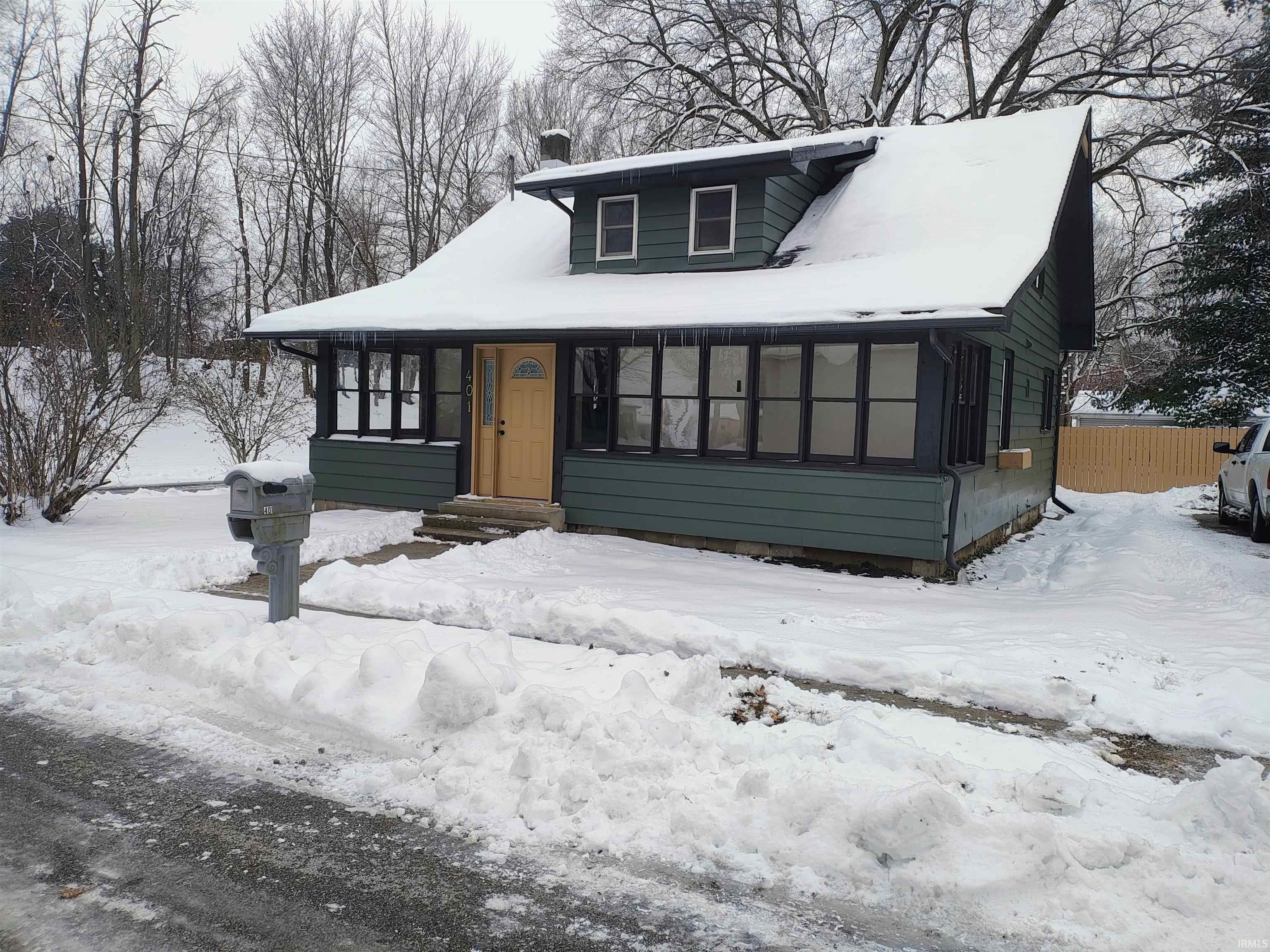 Bungalow-style house with a chimney