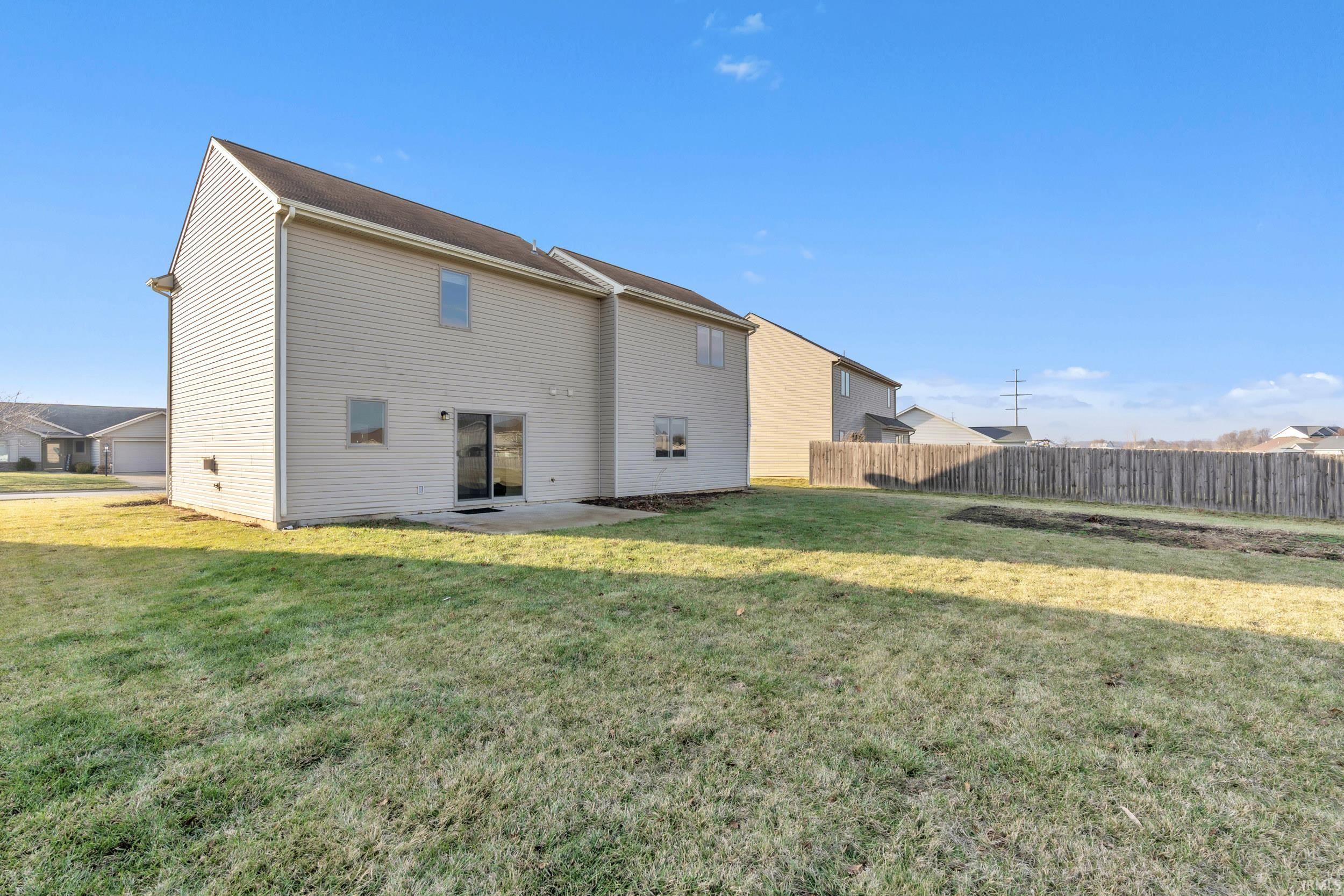 Rear view of property with a patio area