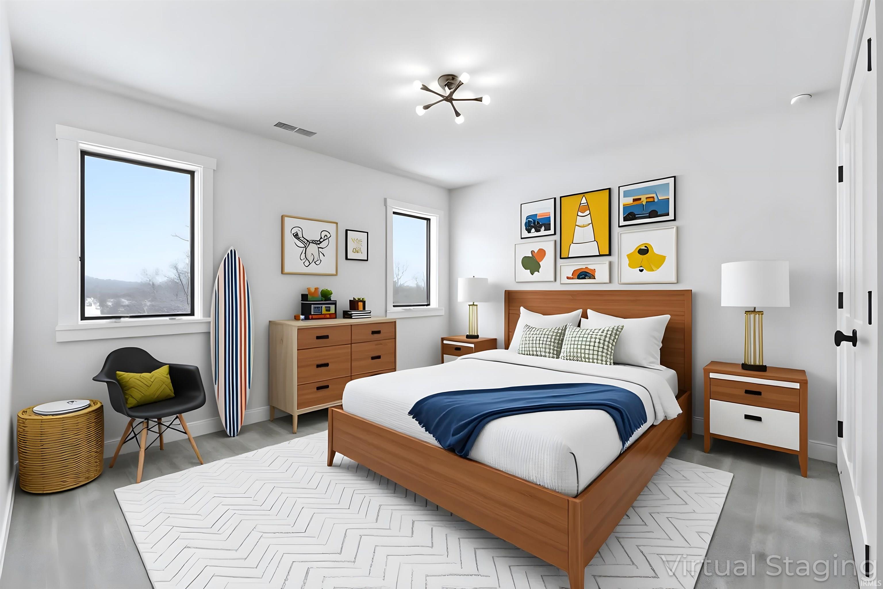 Bedroom featuring baseboards and wood finished floors