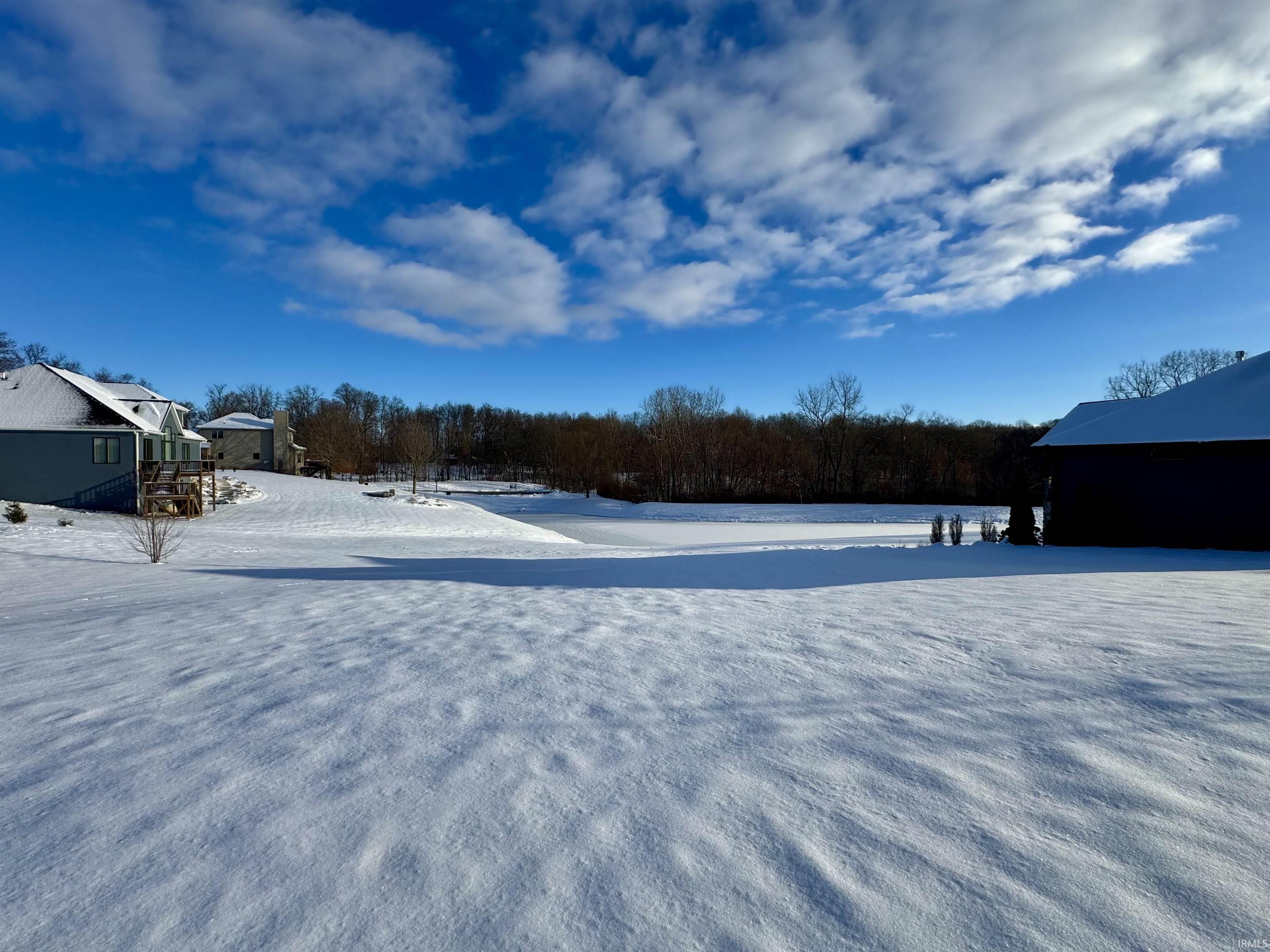 View of yard layered in snow
