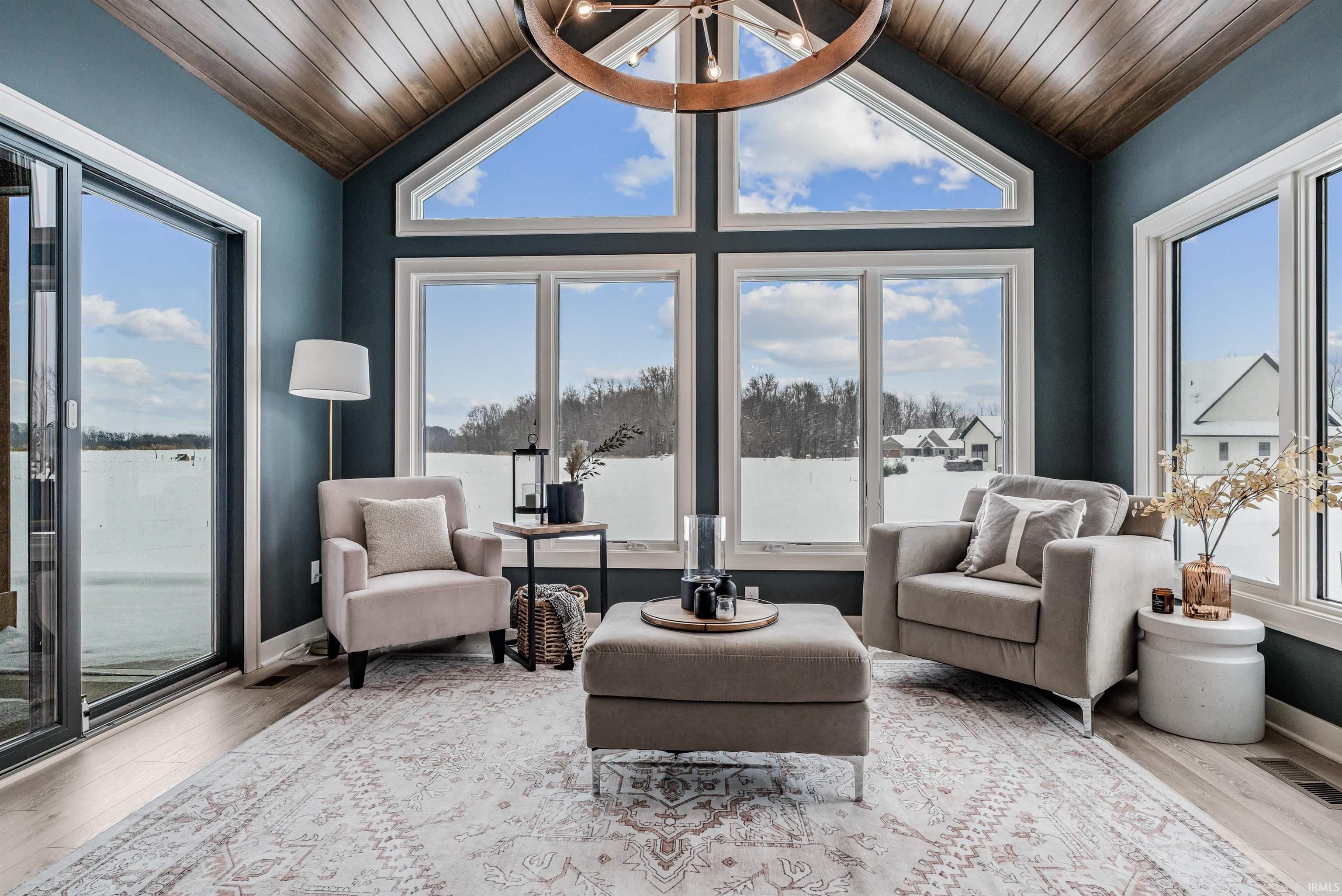 Sunroom / solarium with vaulted ceiling and healthy amount of natural light