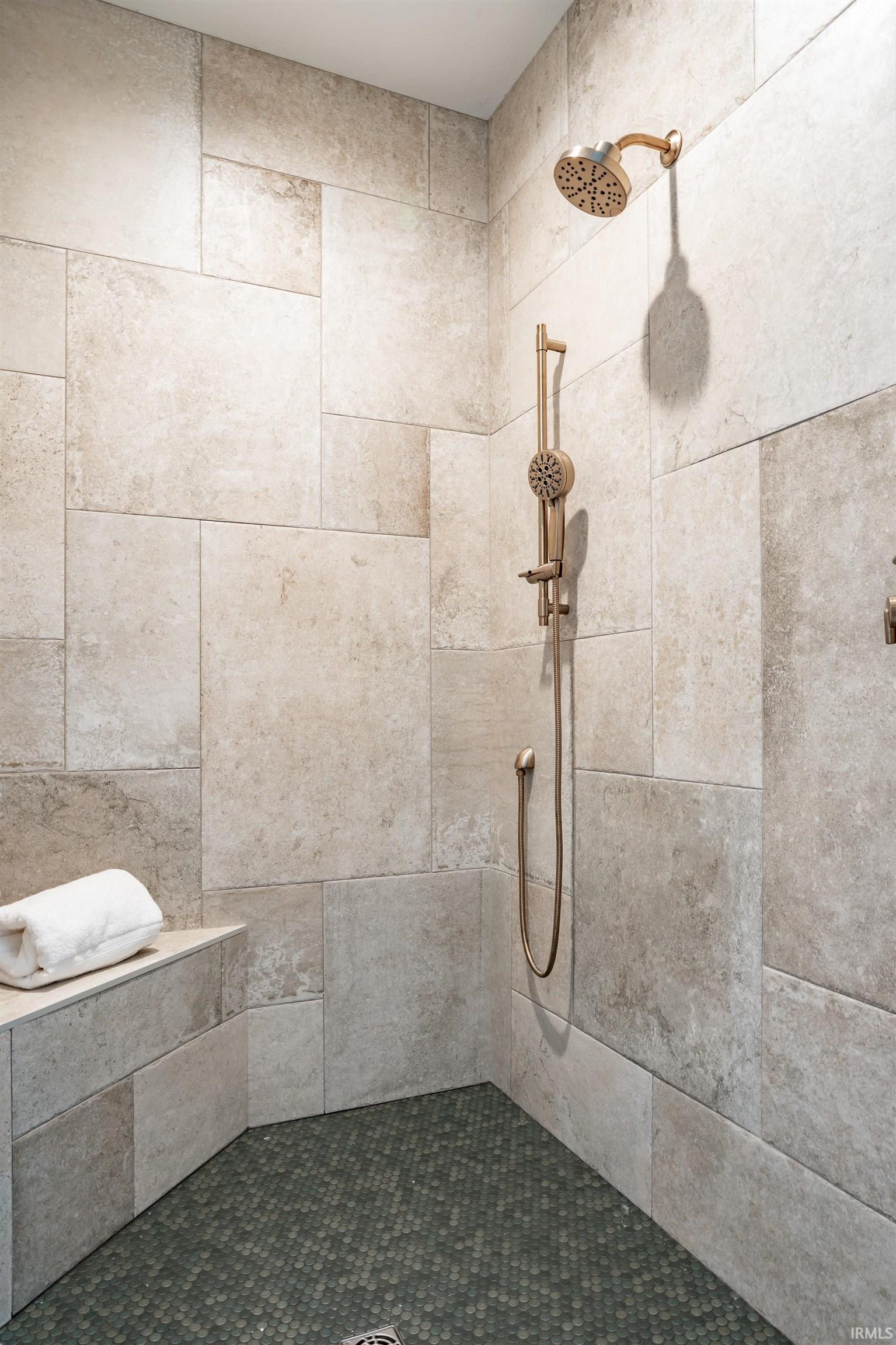 Full bathroom with tiled shower