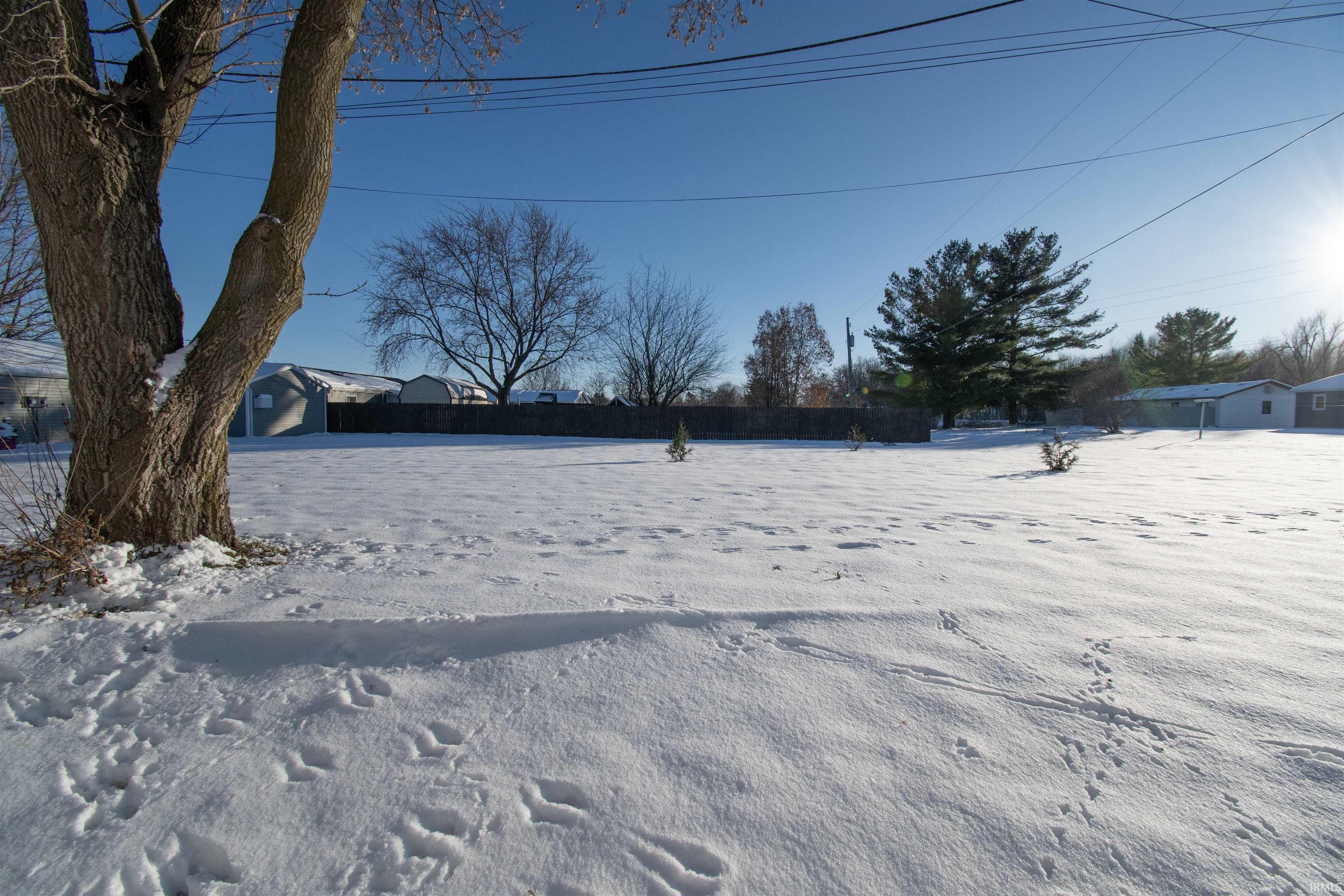 View of yard covered in snow