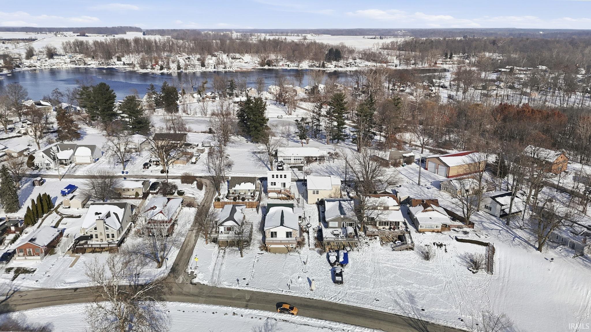 Snowy aerial view featuring a residential view