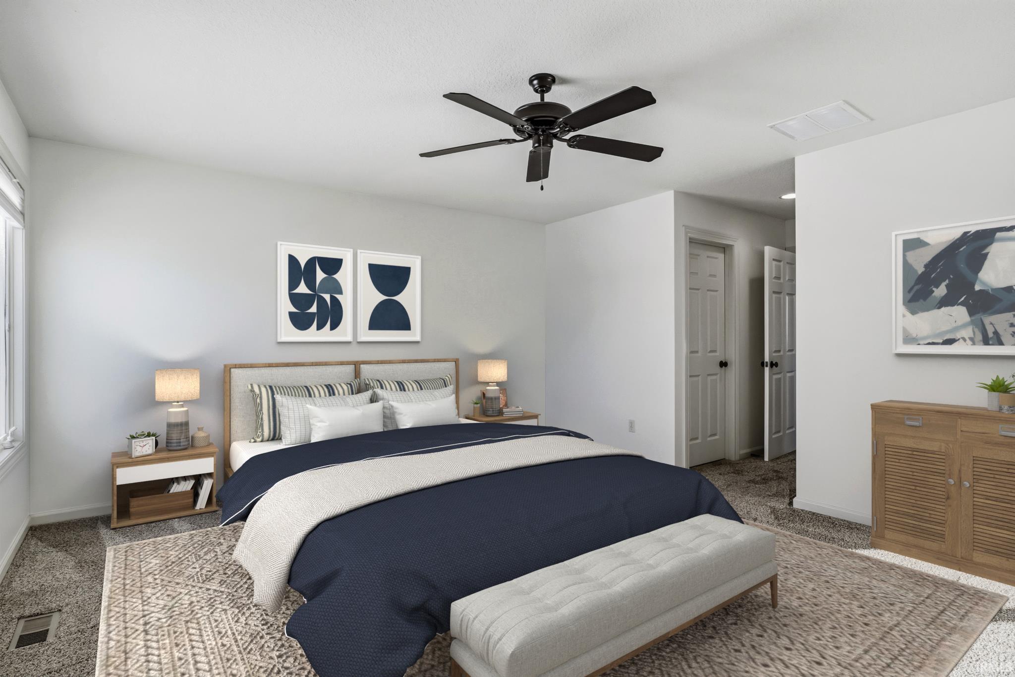 Carpeted bedroom featuring ceiling fan and baseboards