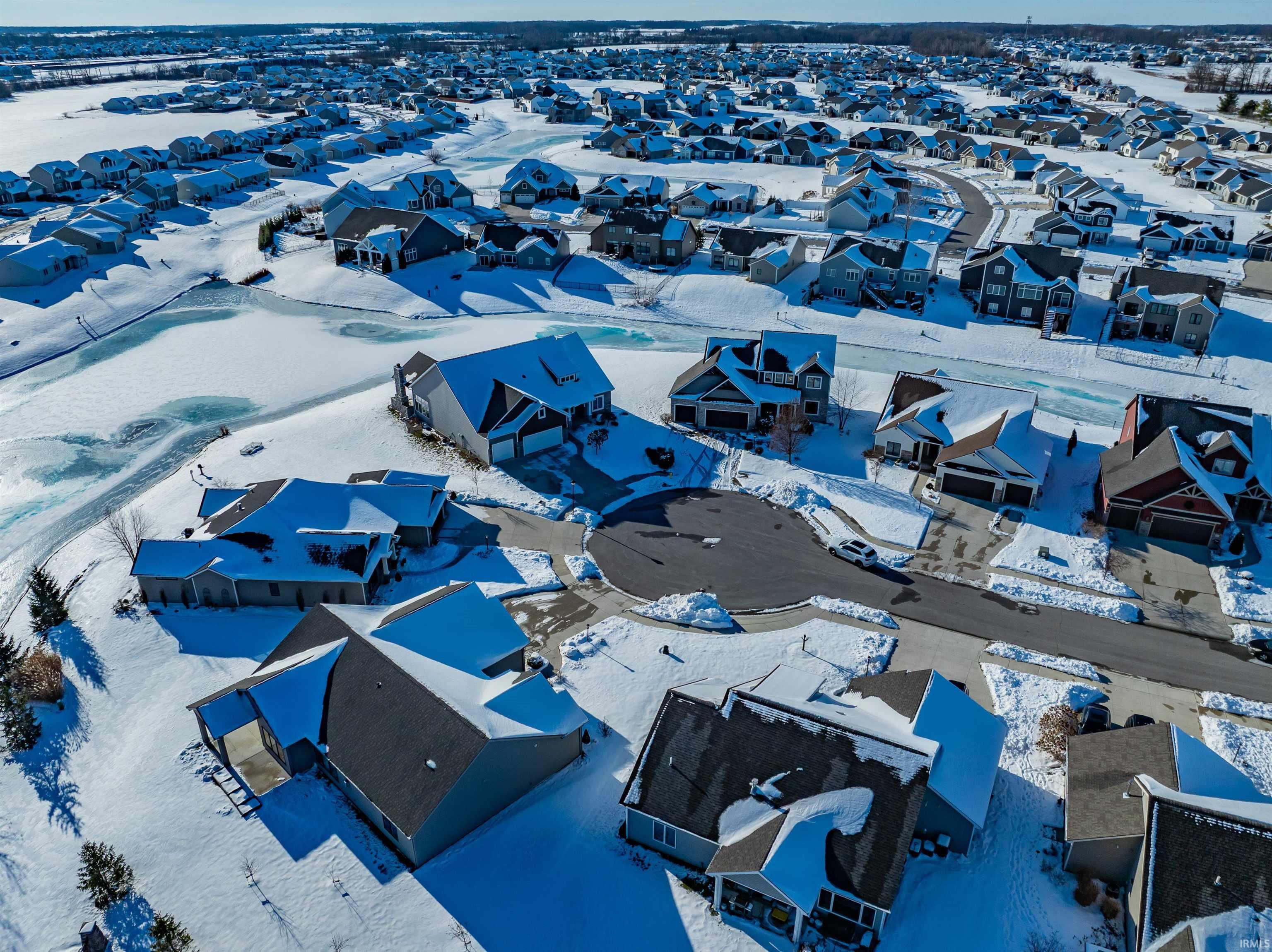 Snowy aerial view with a residential view