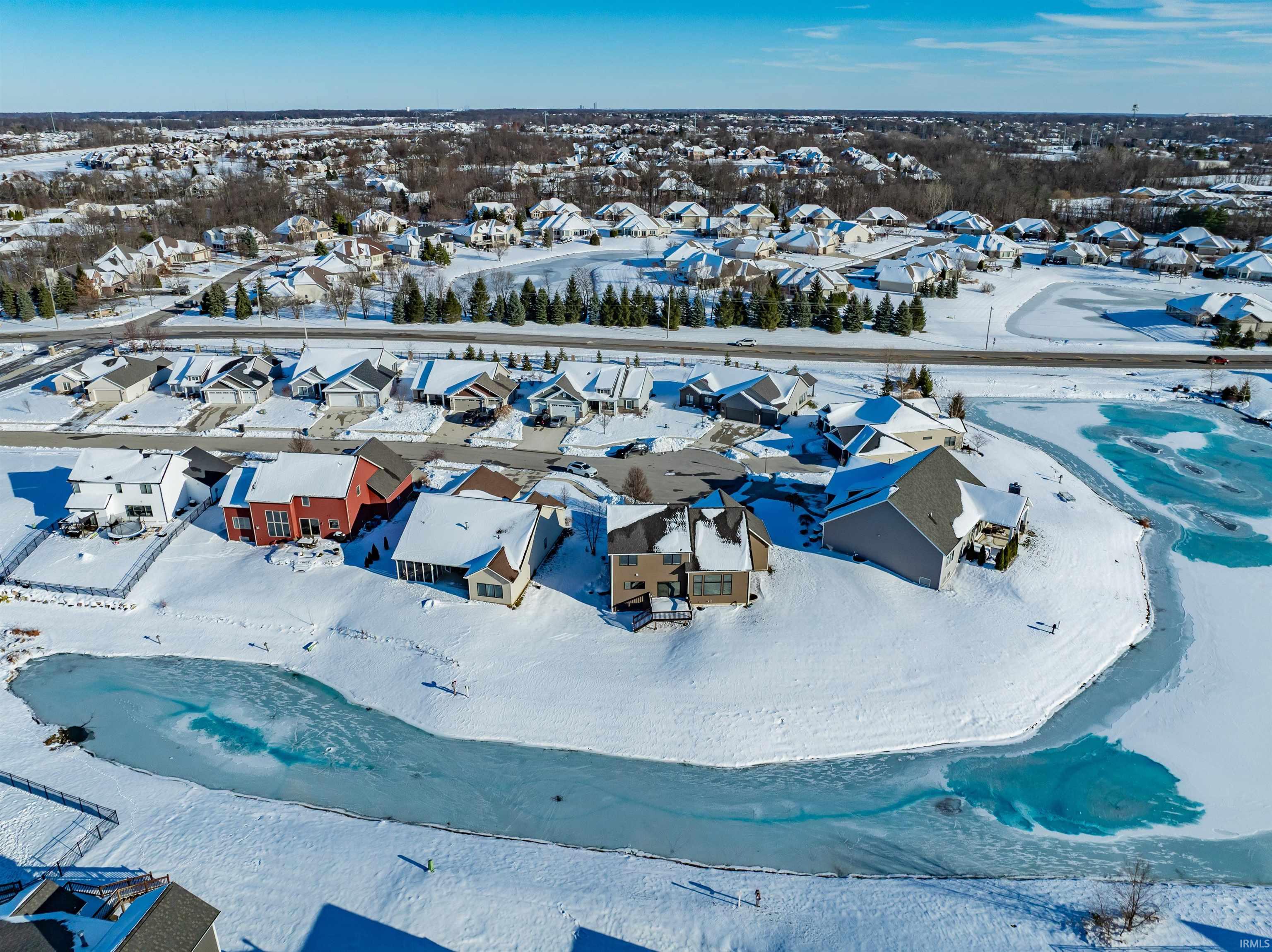 Snowy aerial view with a residential view