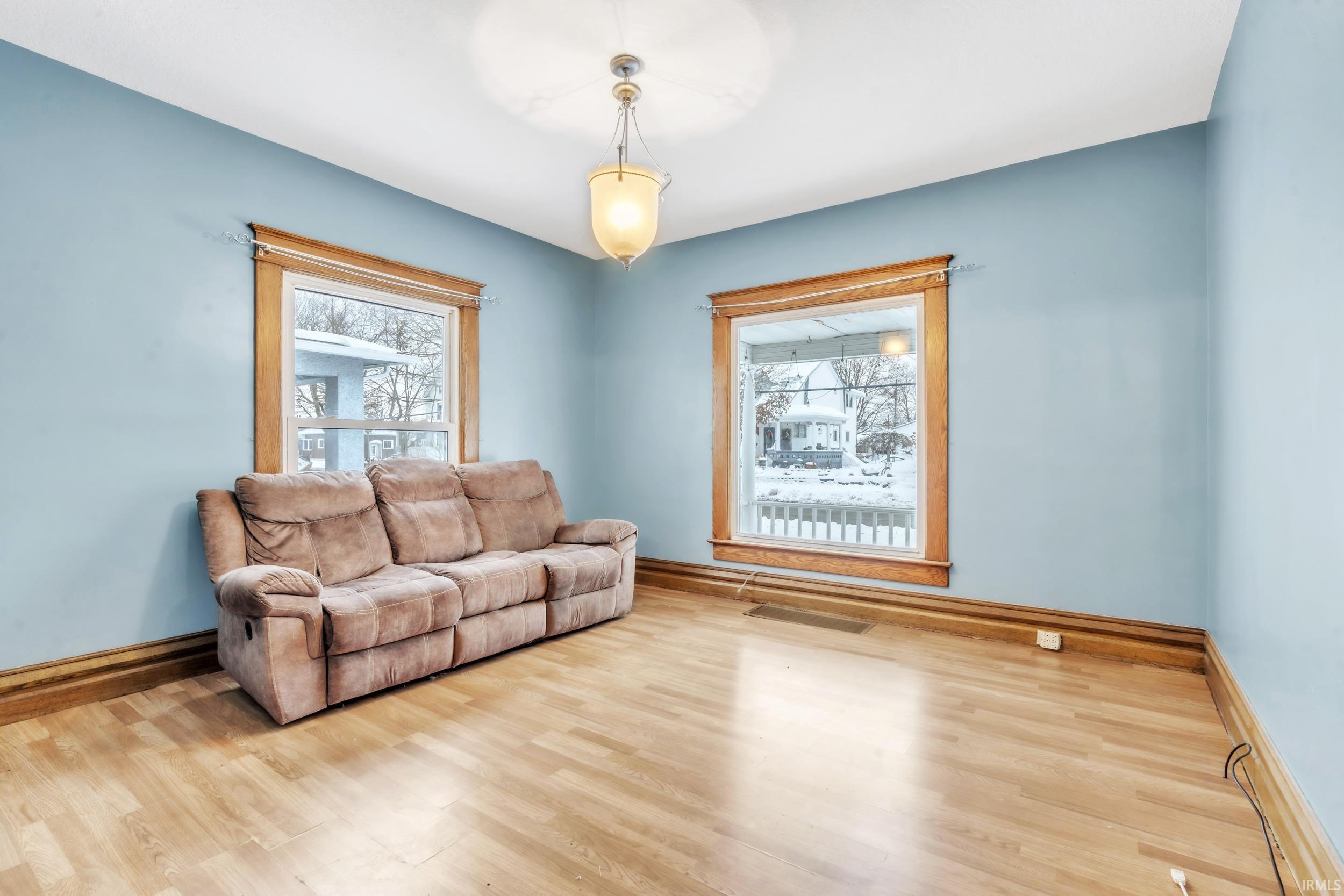 Living room featuring healthy amount of natural light and wood finished floors
