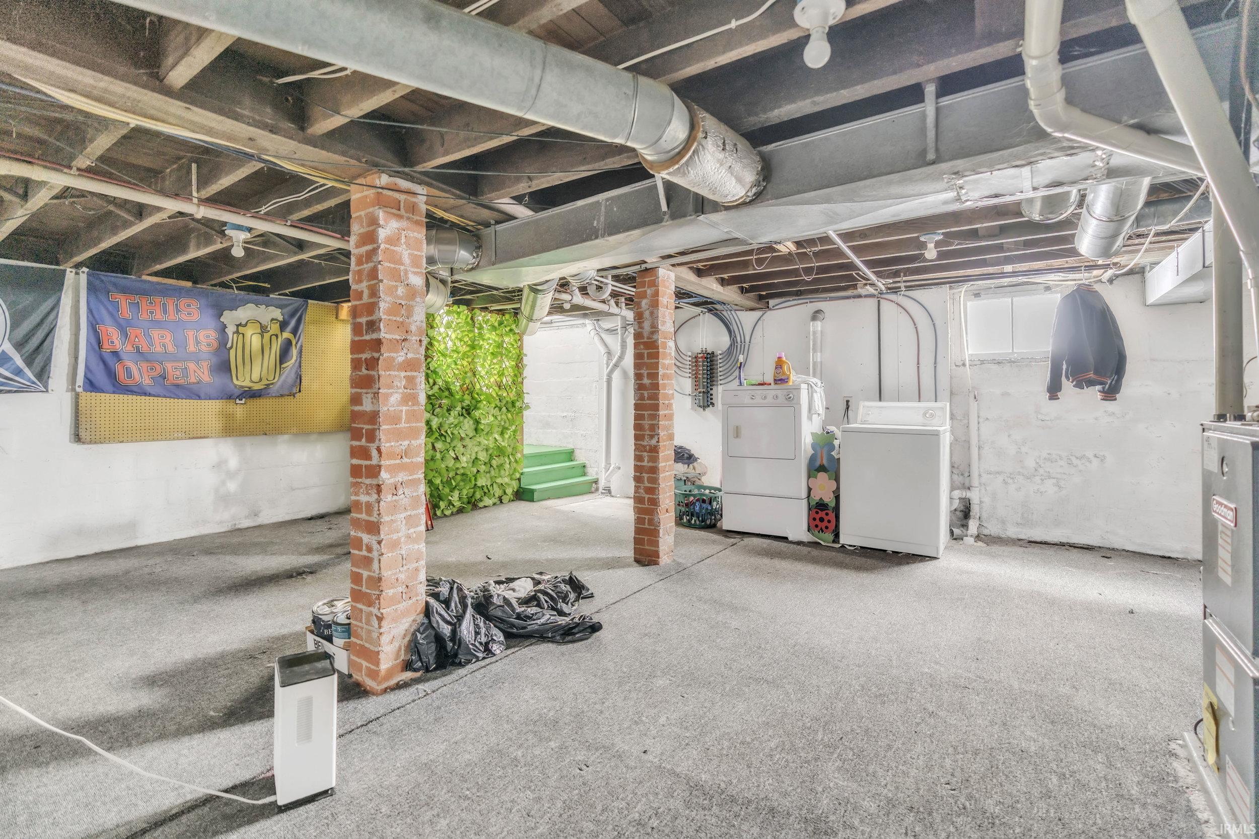 Basement with washing machine and dryer