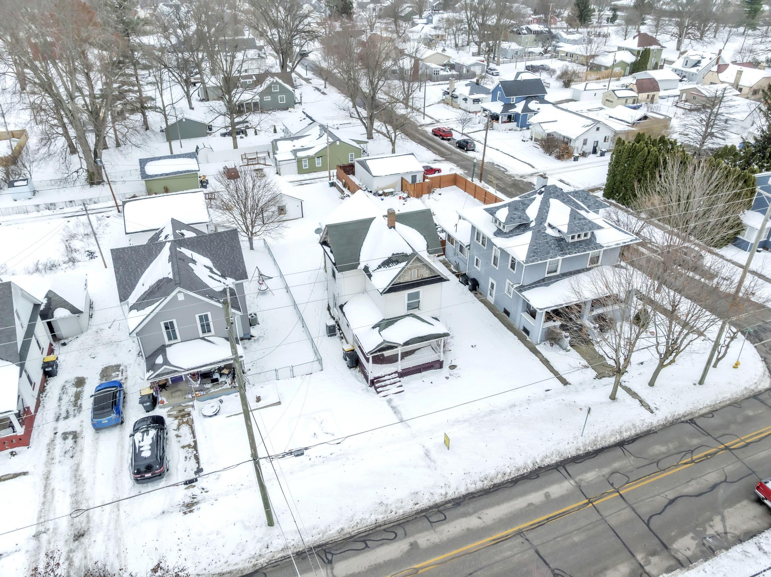 Snowy aerial view with a residential view