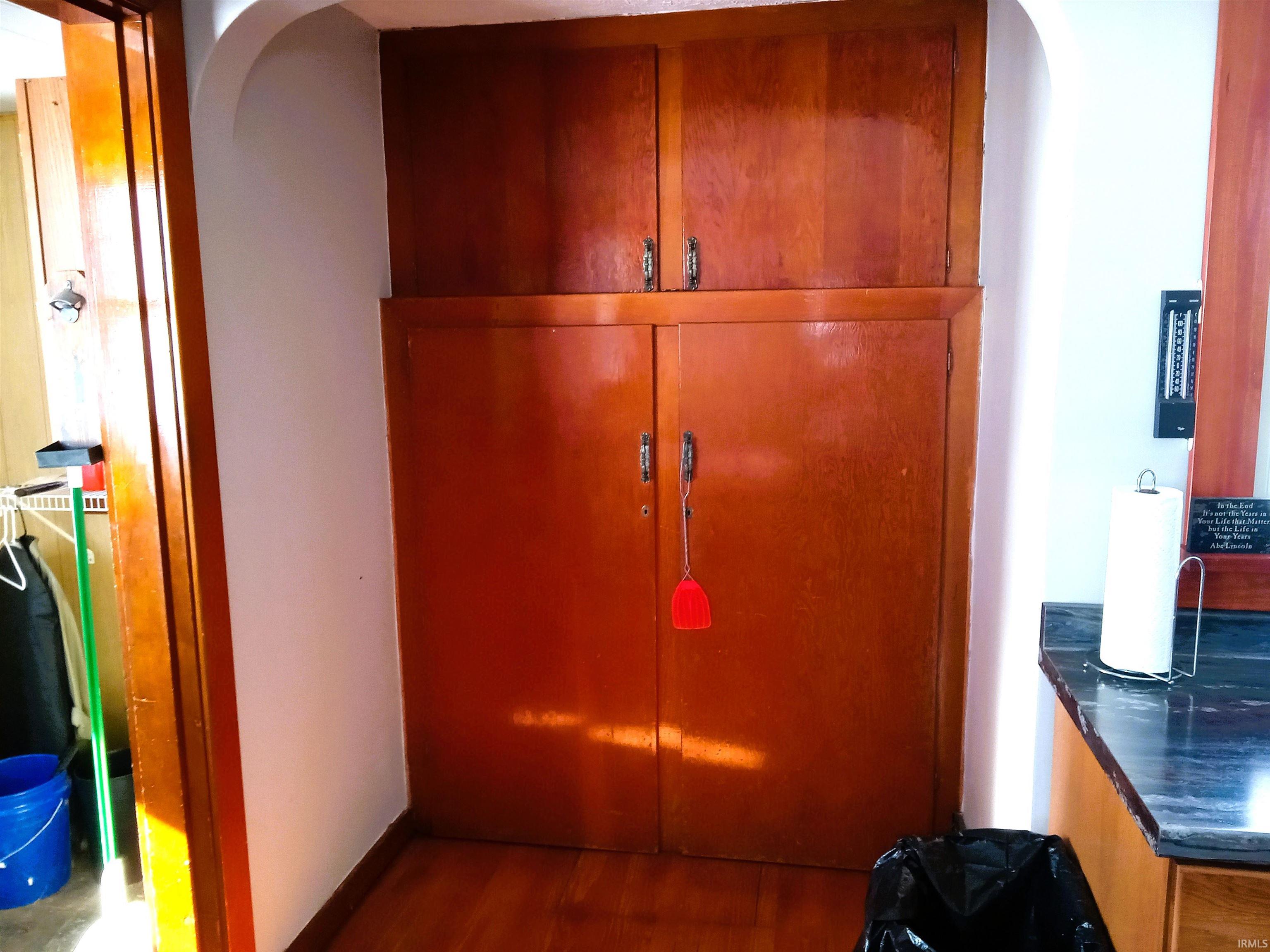 Detailed view of arched walkways and wood finished floors