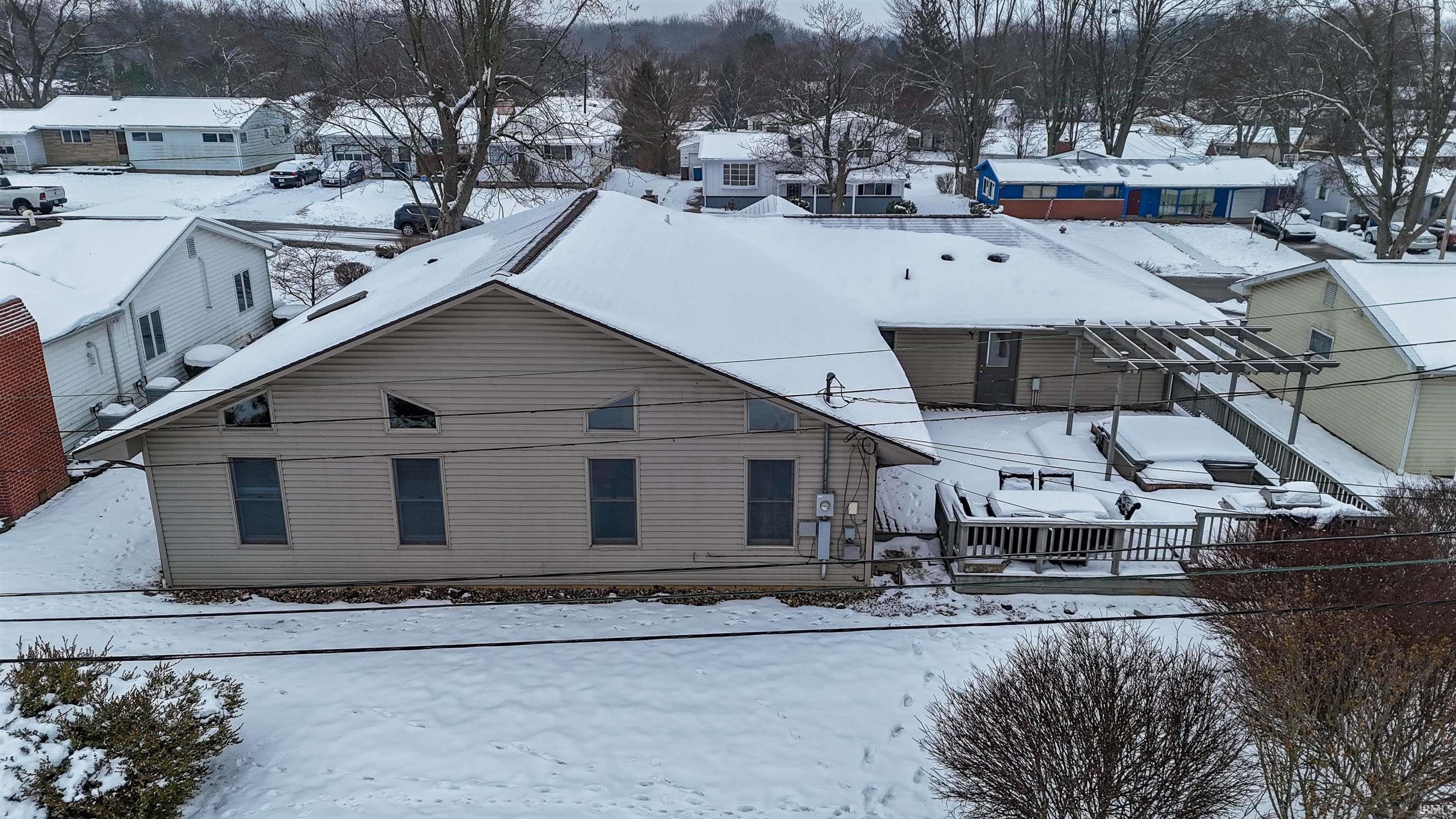 Snowy aerial view with a residential view