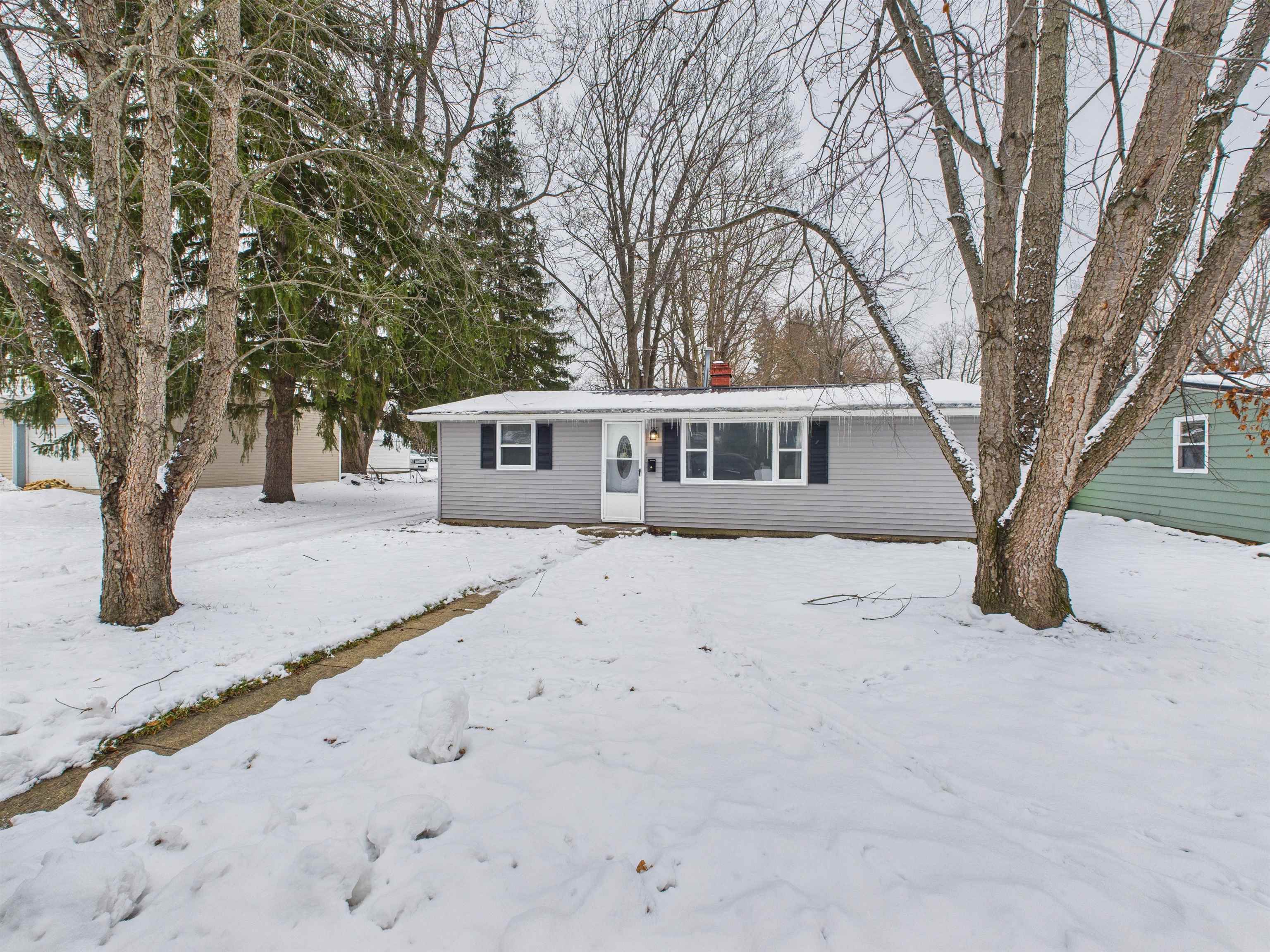 Single story home with a chimney