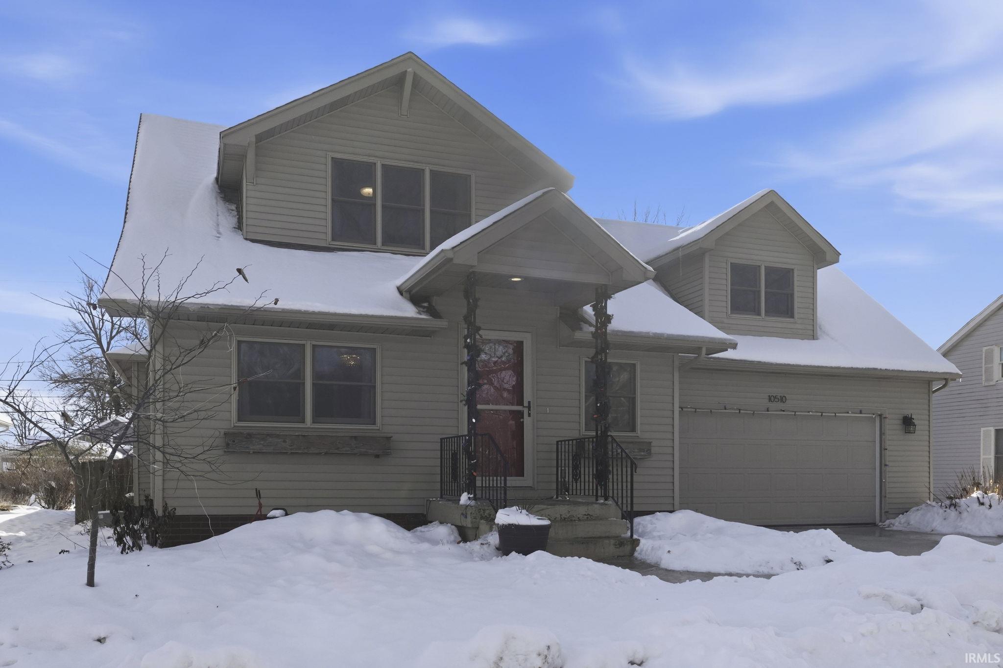 View of front of home with a garage