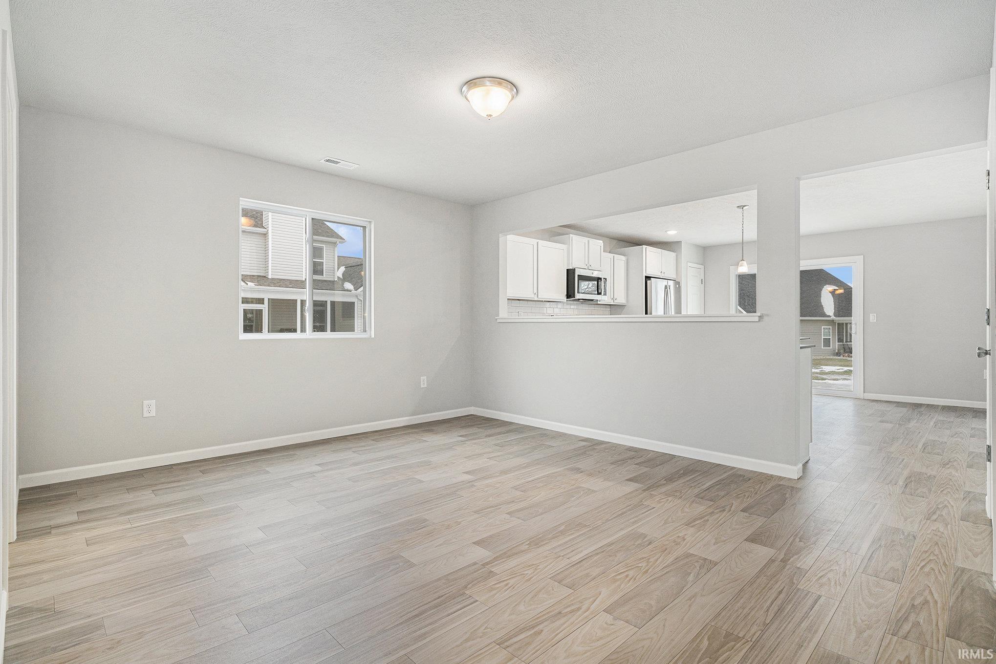 Large dining nook can serve as a formal & informal space since it can accommodate various table sizes and shapes.