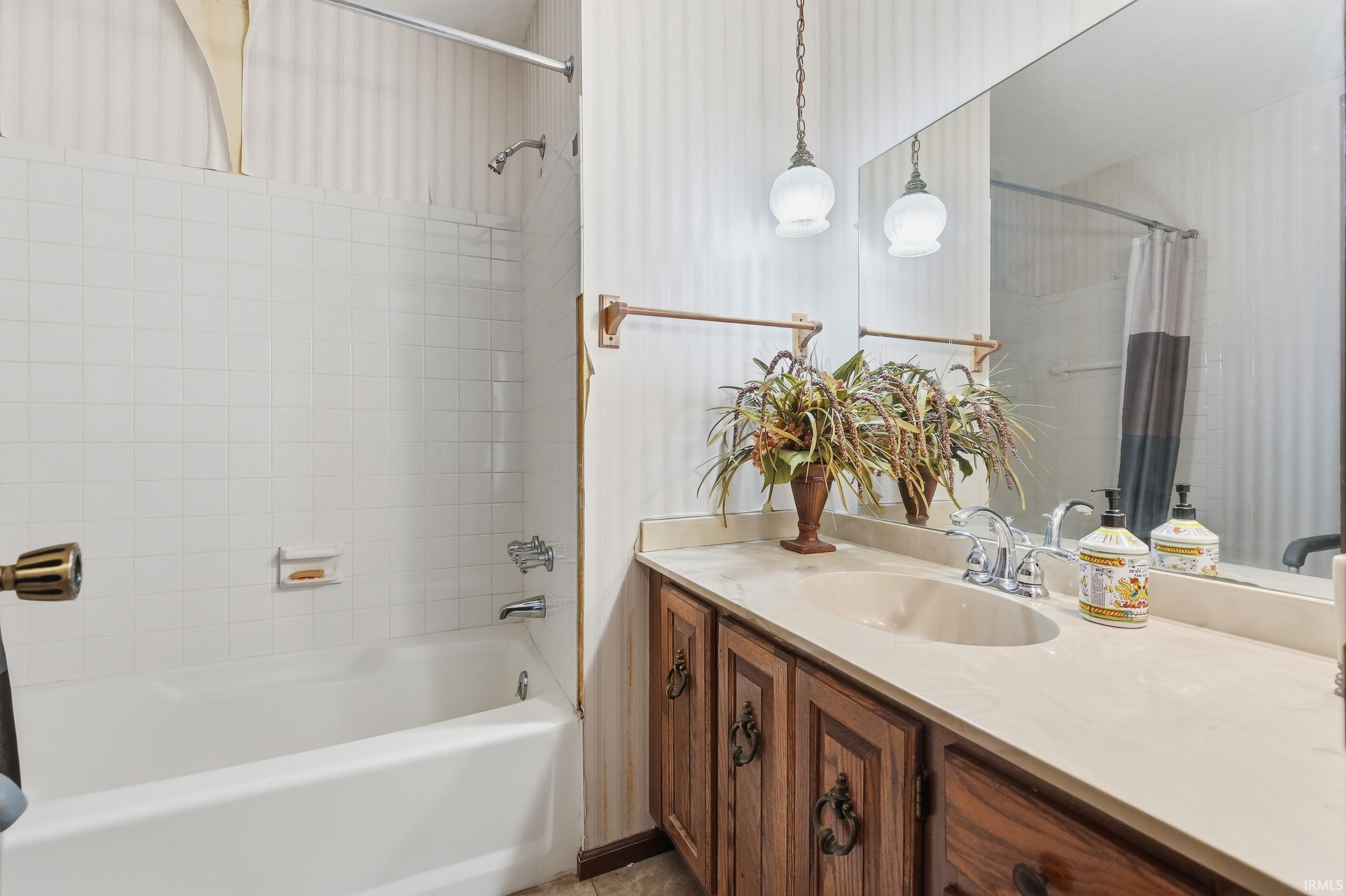 Full bath with vanity and shower / bathtub combination with curtain