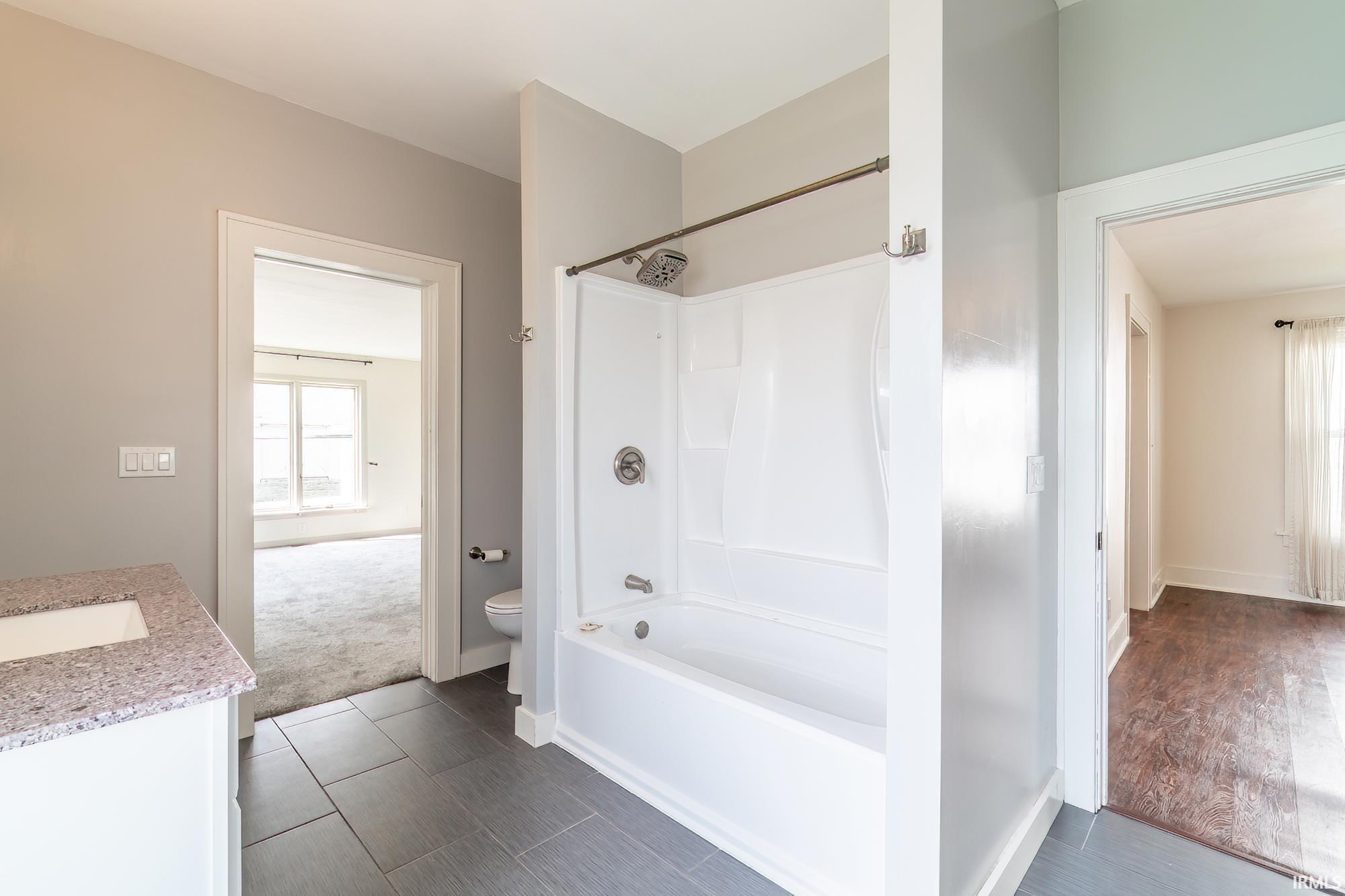 Bathroom featuring vanity and bathtub / shower combination