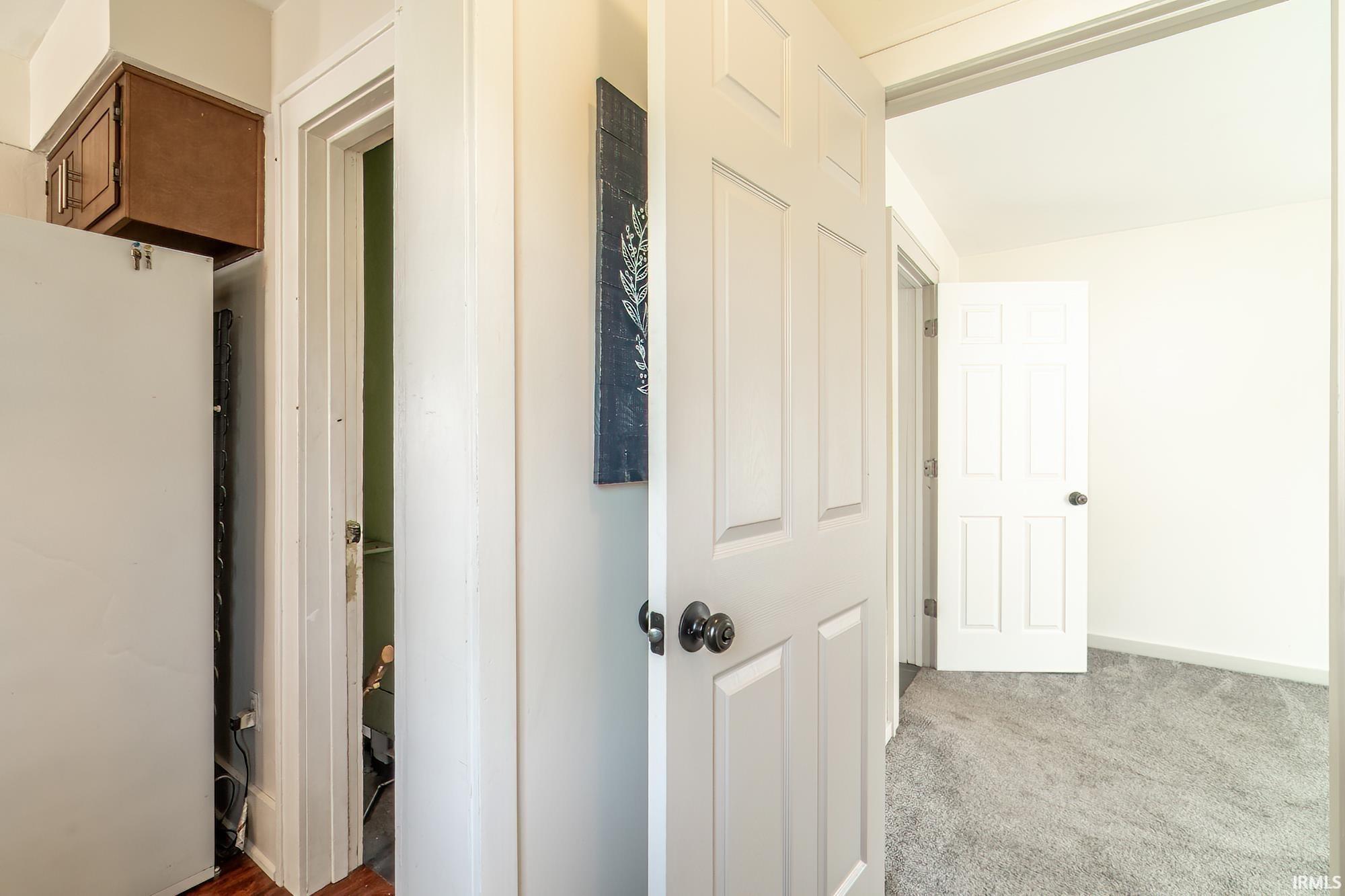 Hallway with carpet floors