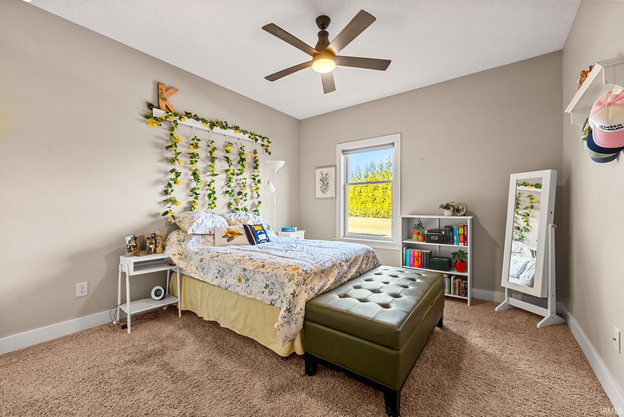 Bedroom with carpet and ceiling fan