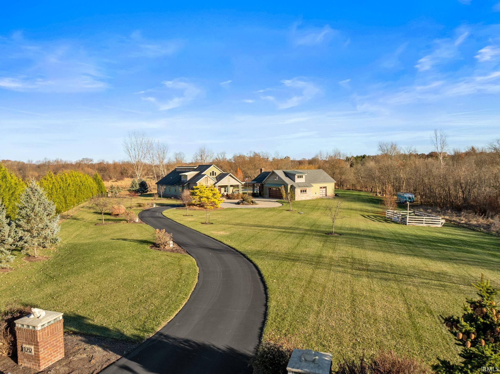 View of front facade featuring a front lawn and a rural view